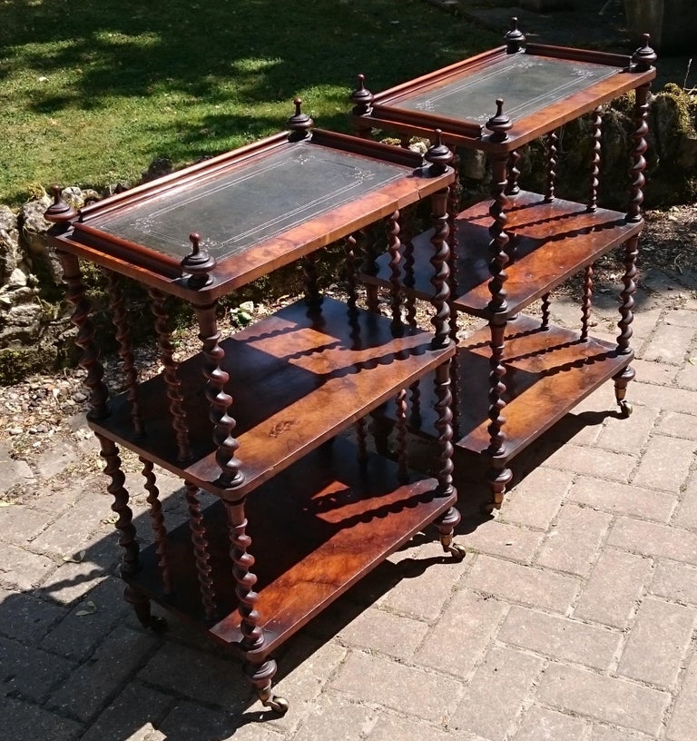 Very fine quality pair of antique walnut whatnots. This pair of whatnots are very well made with generous barley twist columns and wonderfully well figured walnut show wood. The tops are covered with lovely old skiver which might well be the