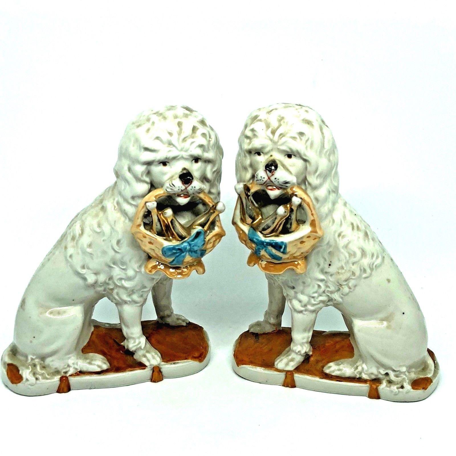 Early 20th century porcelain dog figures, circa 1900s. Placed on your Mantel Shelf they would give your room a classic statement. Very good vintage condition, consistent with age and use.