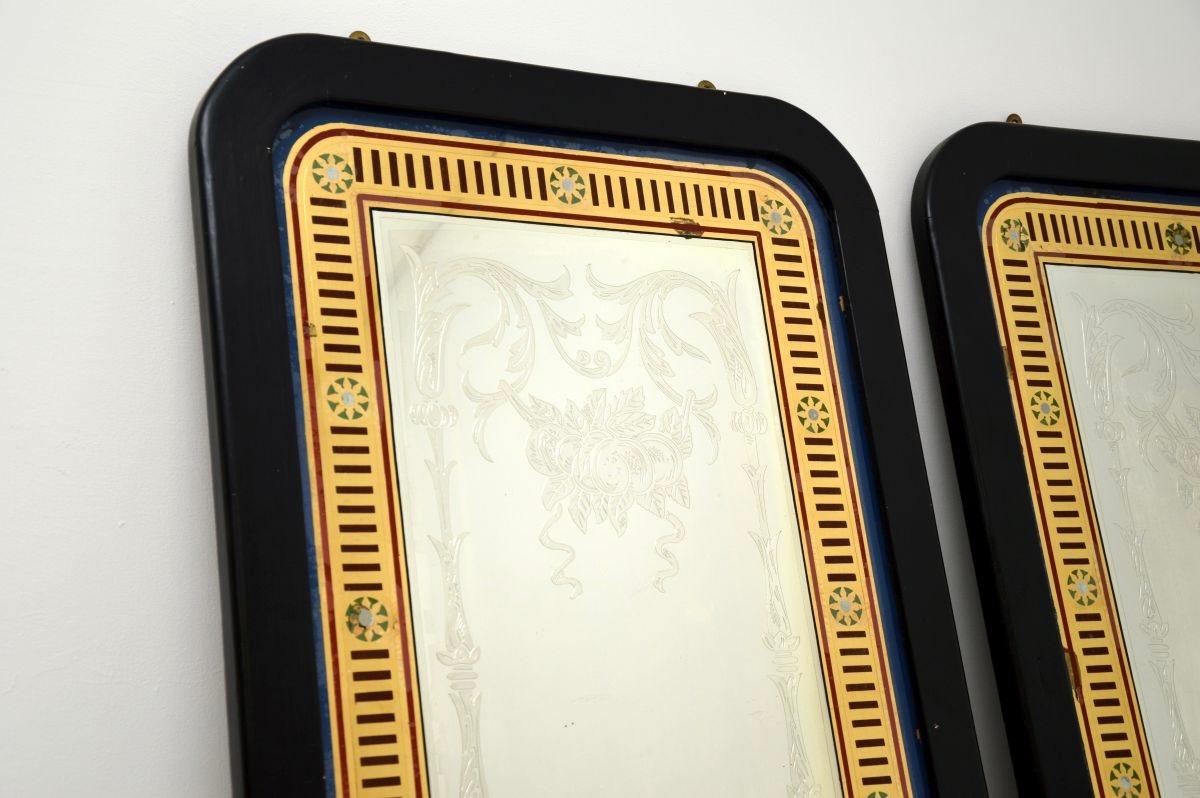 A large and very beautiful pair of antique Victorian pub mirrors. They were made in England, they date from around the 1880-1900 period.

The mirrors are incredibly decorative, with gorgeous etched designs and colours. They have been mounted at a