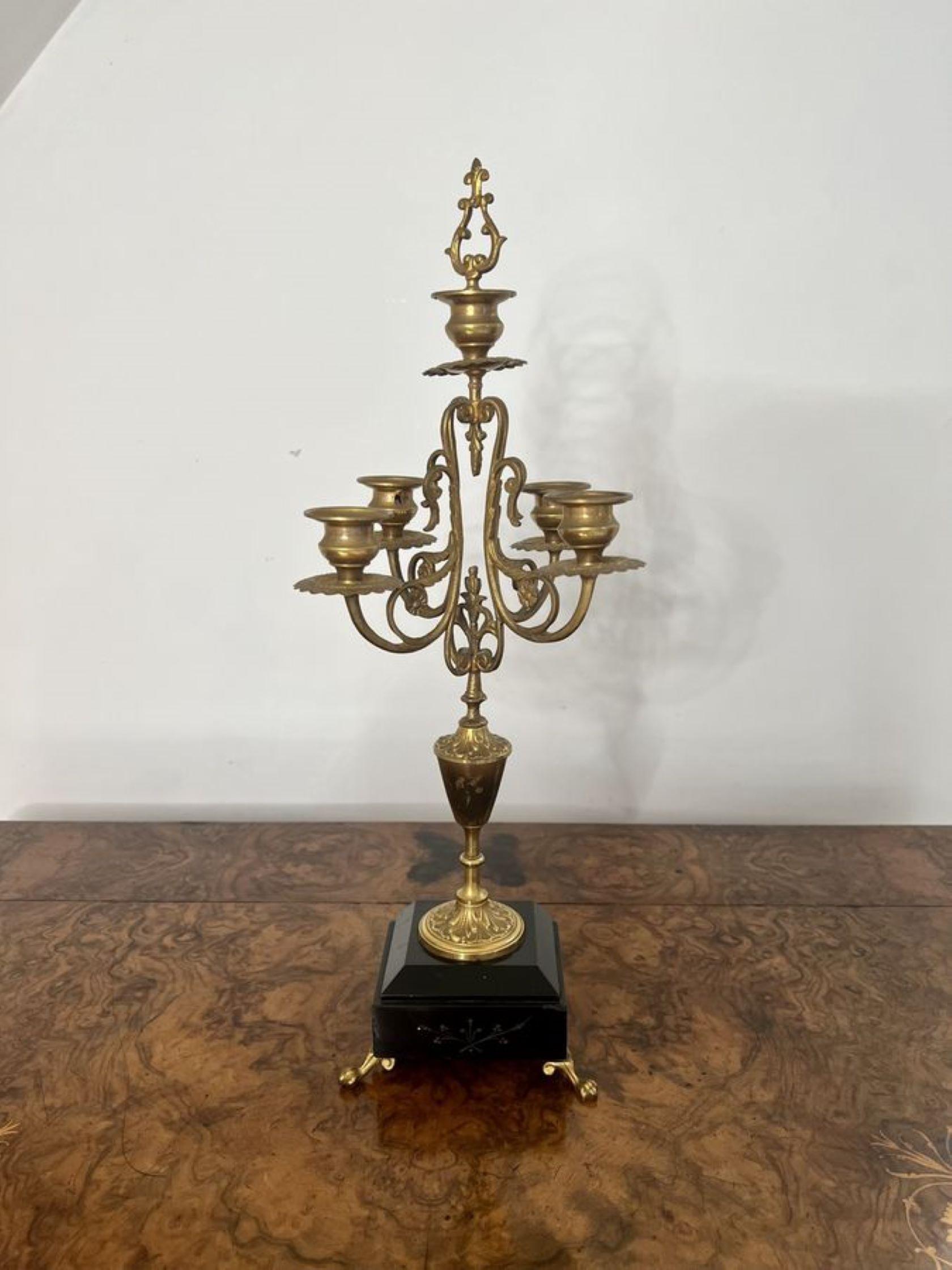Pair of antique Victorian quality brass and marble candelabras having a quality pair of antique Victorian ornate brass candelabras with four branches and one to the centre, standing on marble bases raised on fantastic shaped brass feet.
