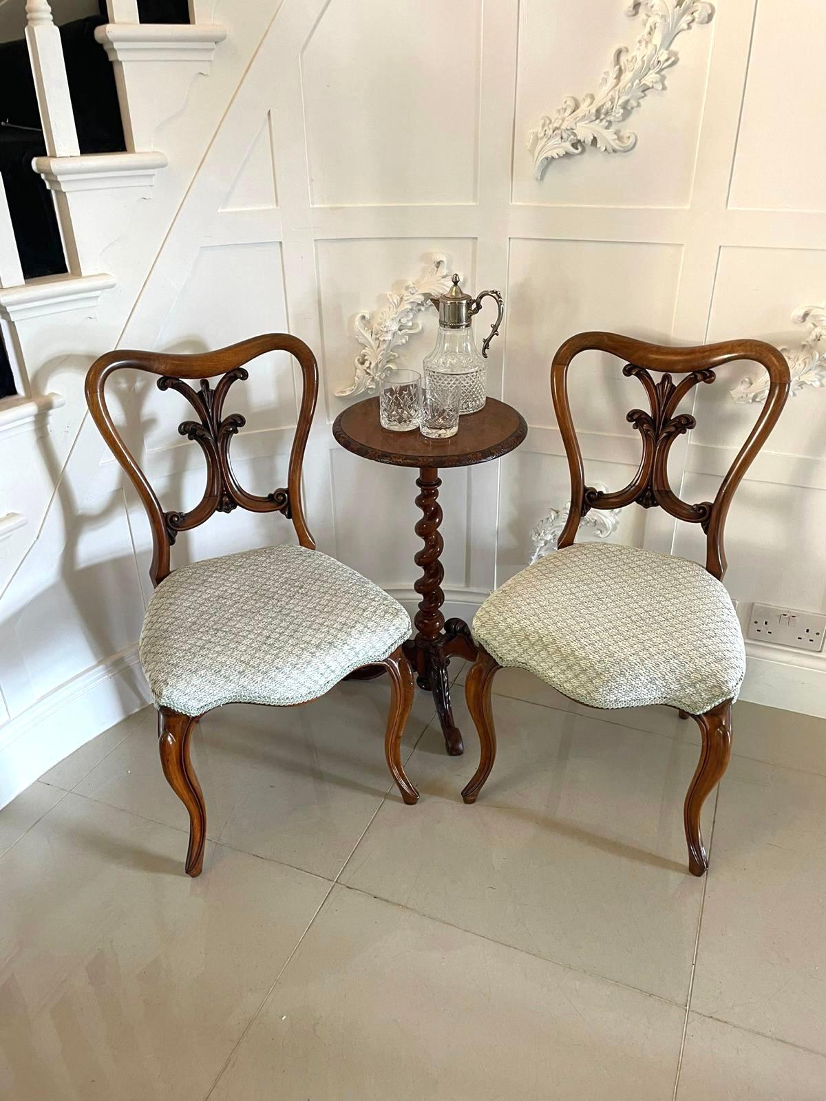 Pair of antique Victorian quality carved walnut side chairs having fantastic quality carved solid walnut shaped backs, newly reupholstered serpentine shaped seats in a quality fabric and standing on shaped cabriole legs to the front and out swept
