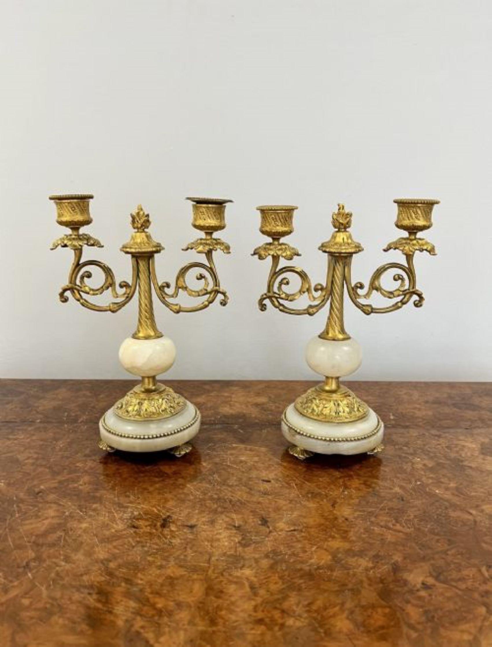 Pair of antique Victorian quality ormolu and marble candelabras having a quality pair of antique Victorian ormolu and white marble candelabra with two ornate branches standing on circular bases 