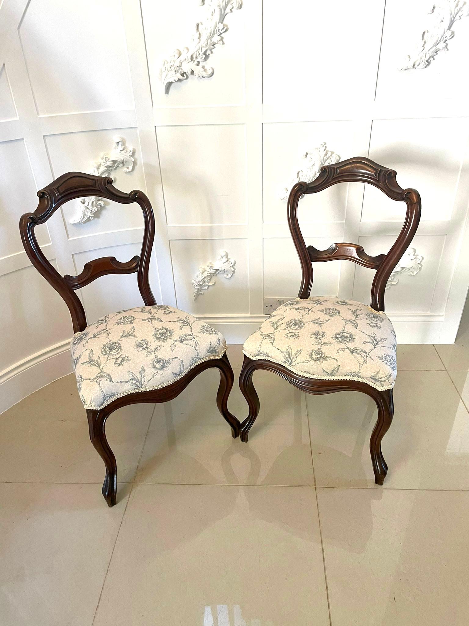 Pair of antique Victorian quality walnut side chairs having a quality carved scroll shaped back, newly reupholstered serpentine shaped seats in a quality fabric and standing on shaped cabriole legs to the front and out swept back legs 

A Charming