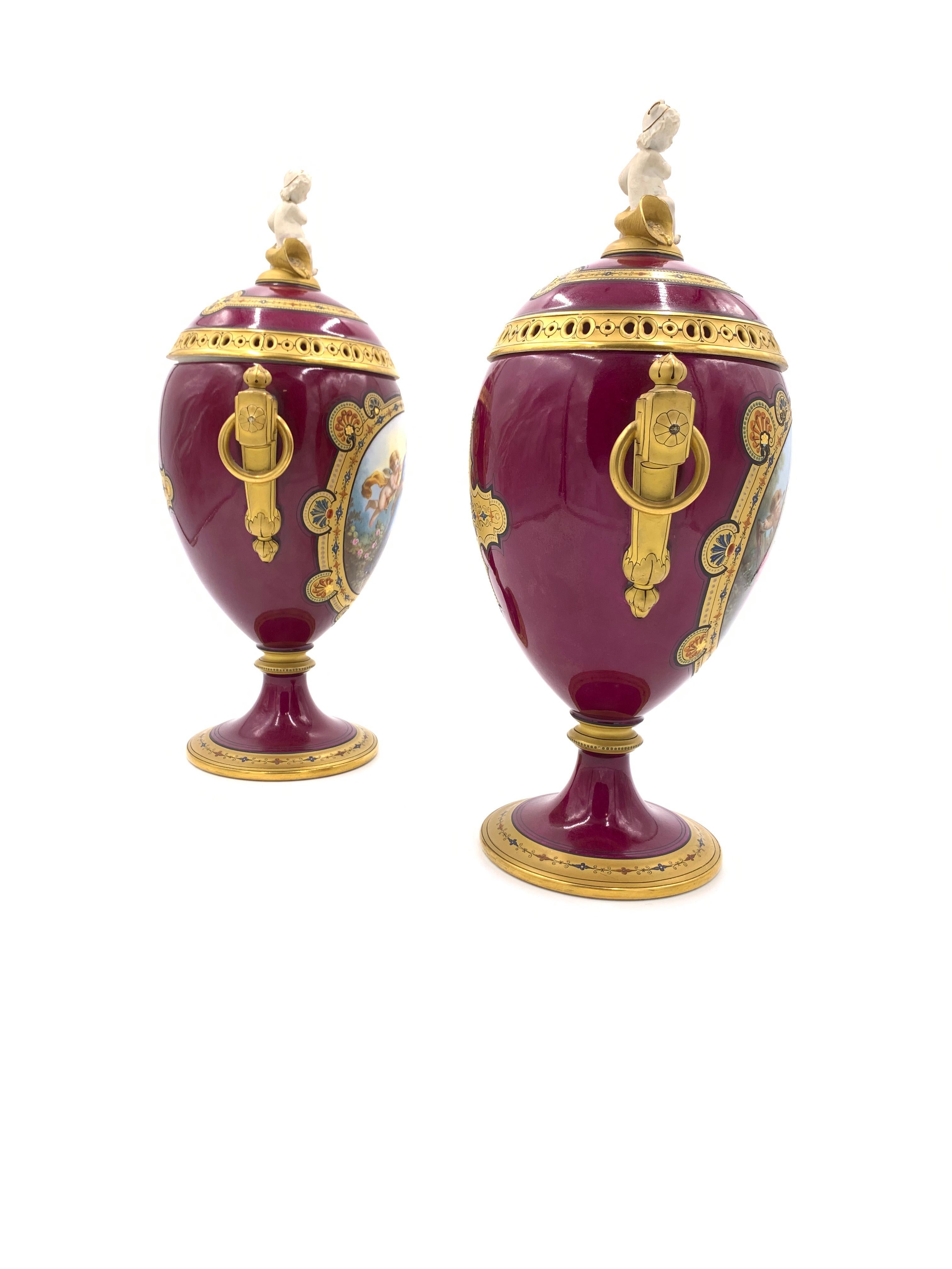 Exquisite quality vases in red, painting on the front and a cross on the revers of each vase.
  