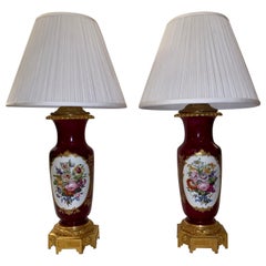 Coppia di lampade antiche in porcellana "Vieux Paris" con montatura in ormù
