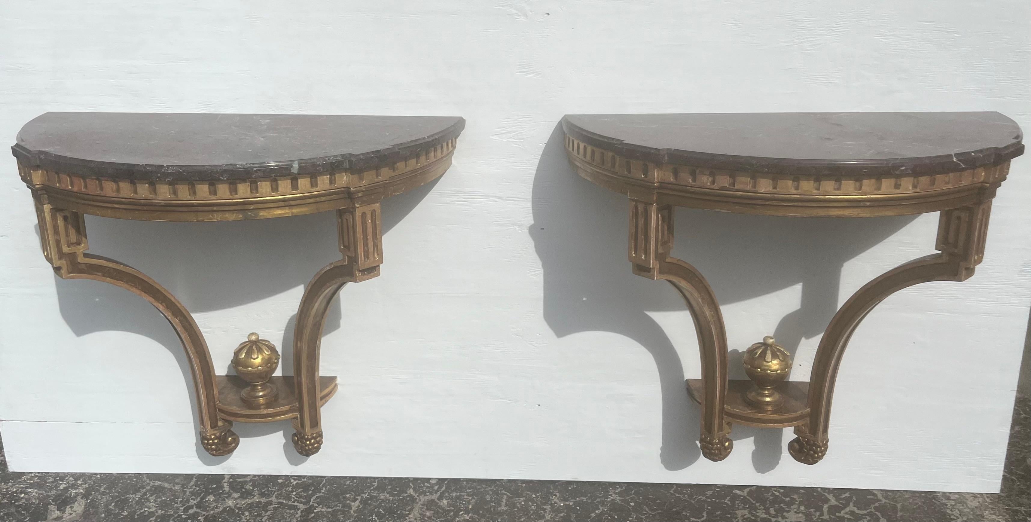 Pair of Antique Wall-Mounted Console Tables, Wood with gold finish, Marble Tops, age unknown.