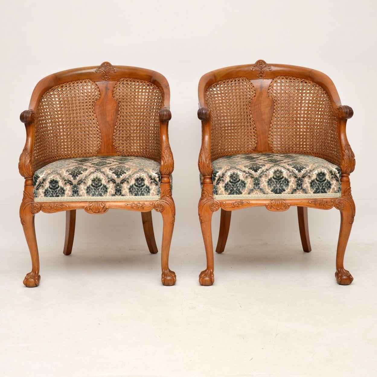 This pair of antique solid walnut bergere armchairs are great quality and superbly carved all over. Please enlarge all the images to see all the fine details. They are double caned either sides of the central splats and the cane is all original and