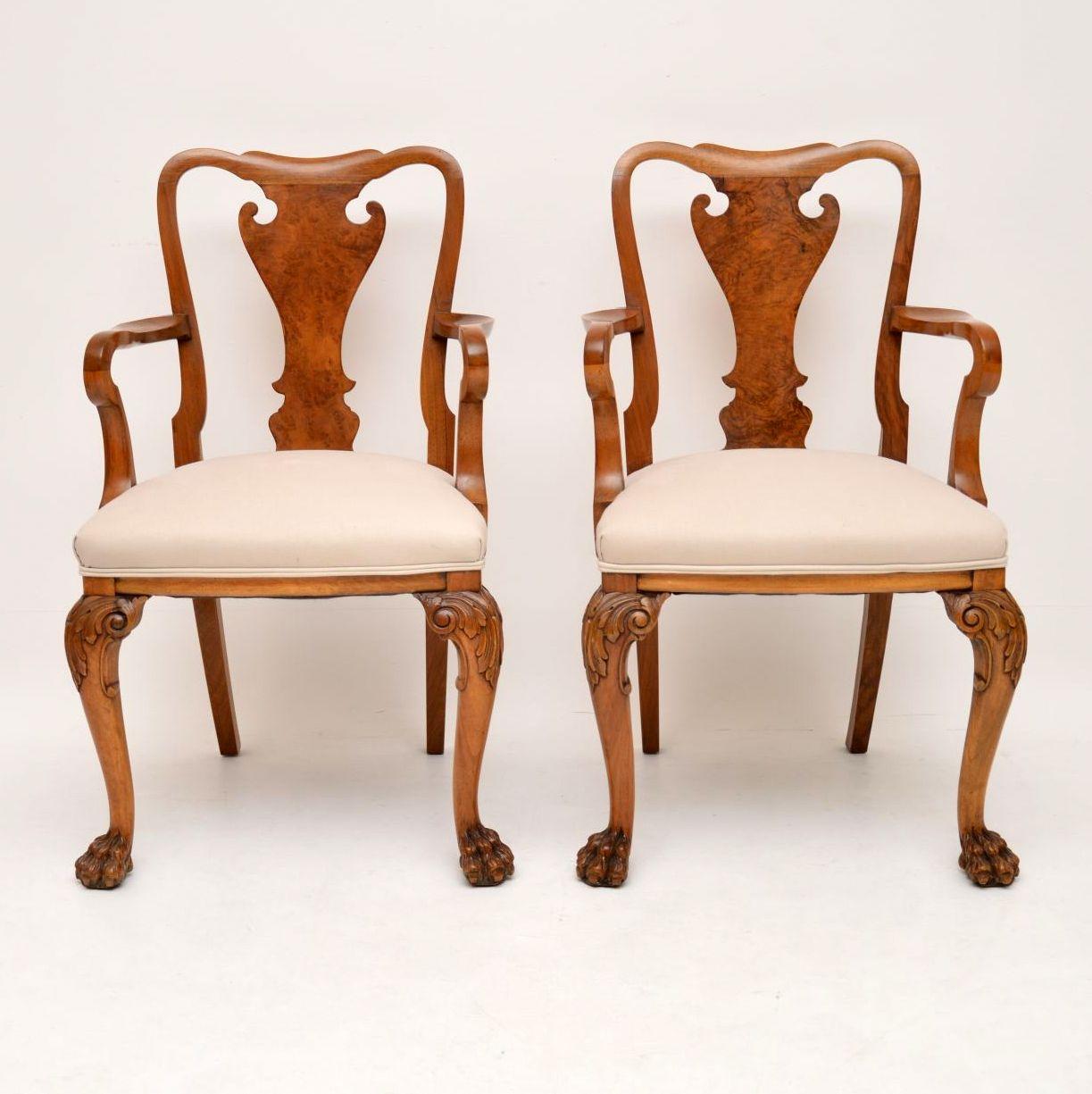 Fabulous quality pair of antique Queen Anne style solid walnut armchairs dating to circa 1920s period. They are in excellent condition, having just been French polished and re-upholstered. They have burr walnut urn shaped central splats, shepherd
