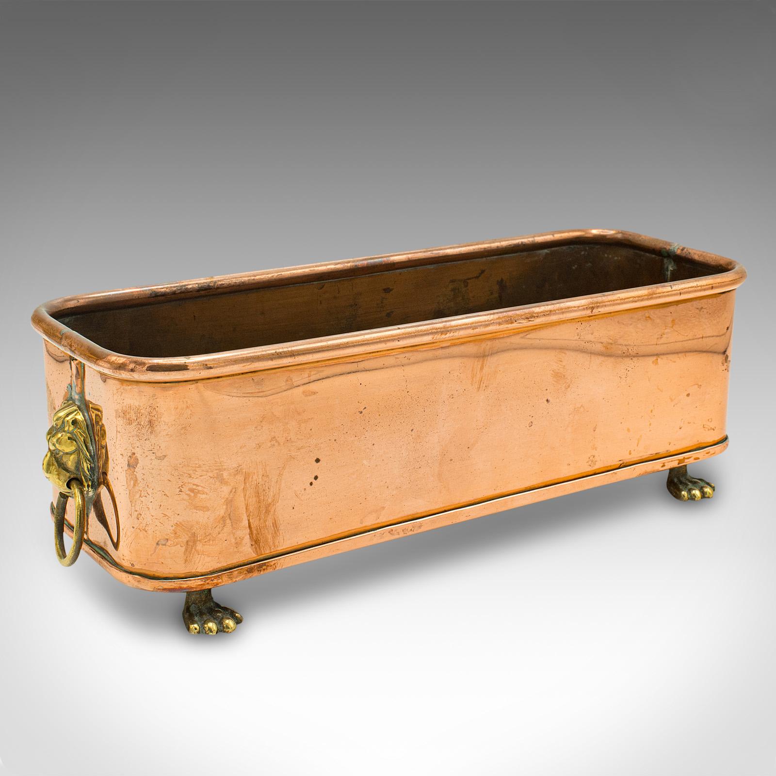 This is a pair of antique windowsill planters. An English, copper and brass jardiniere trough, dating to the early Victorian period, circa 1850.

Beautifully presented, to add a dash of flair to your windowsill
Displaying a desirable aged patina