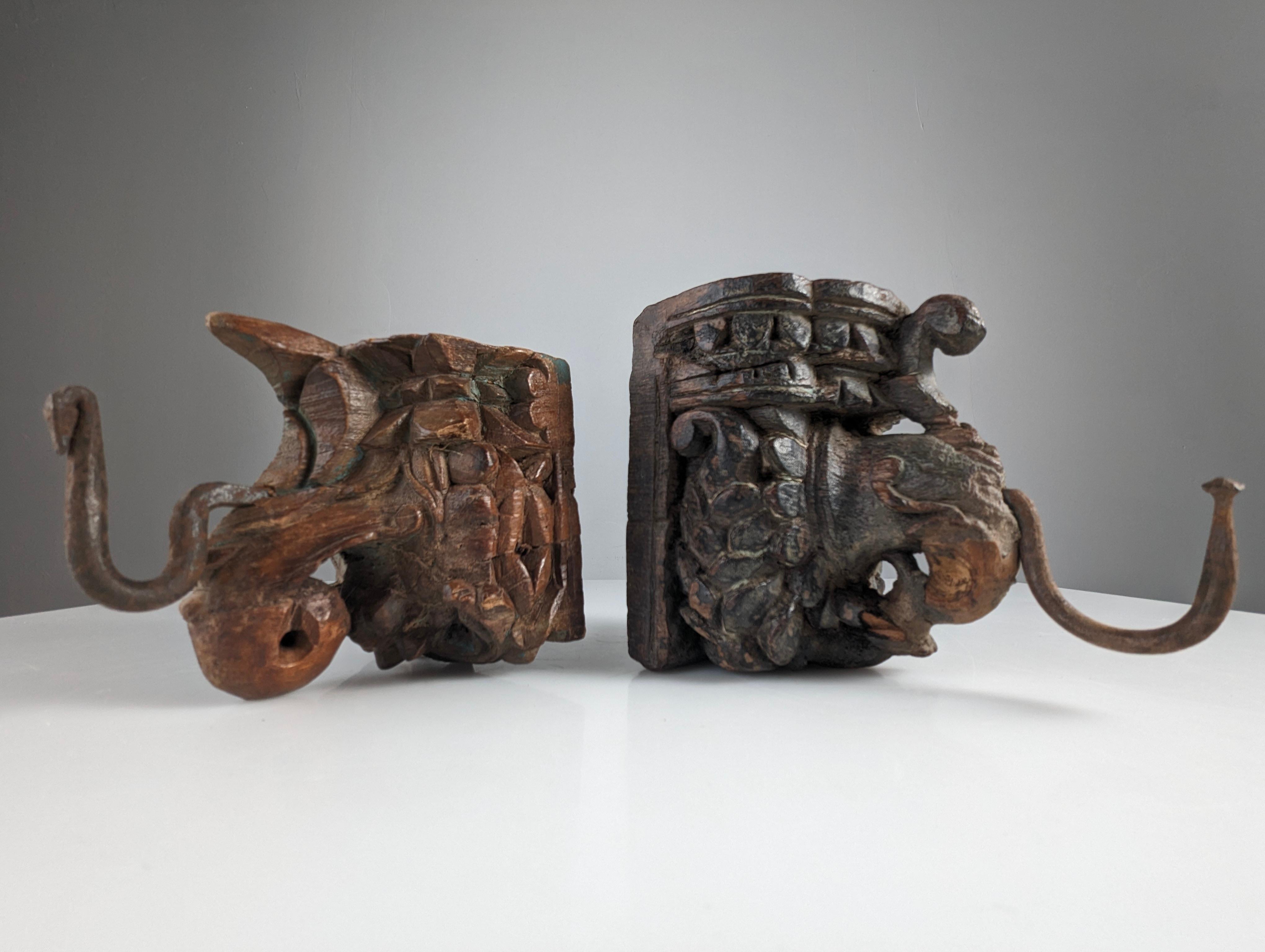 Asian Pair of Antique Wood Carved Elephant Head Hangers, India For Sale