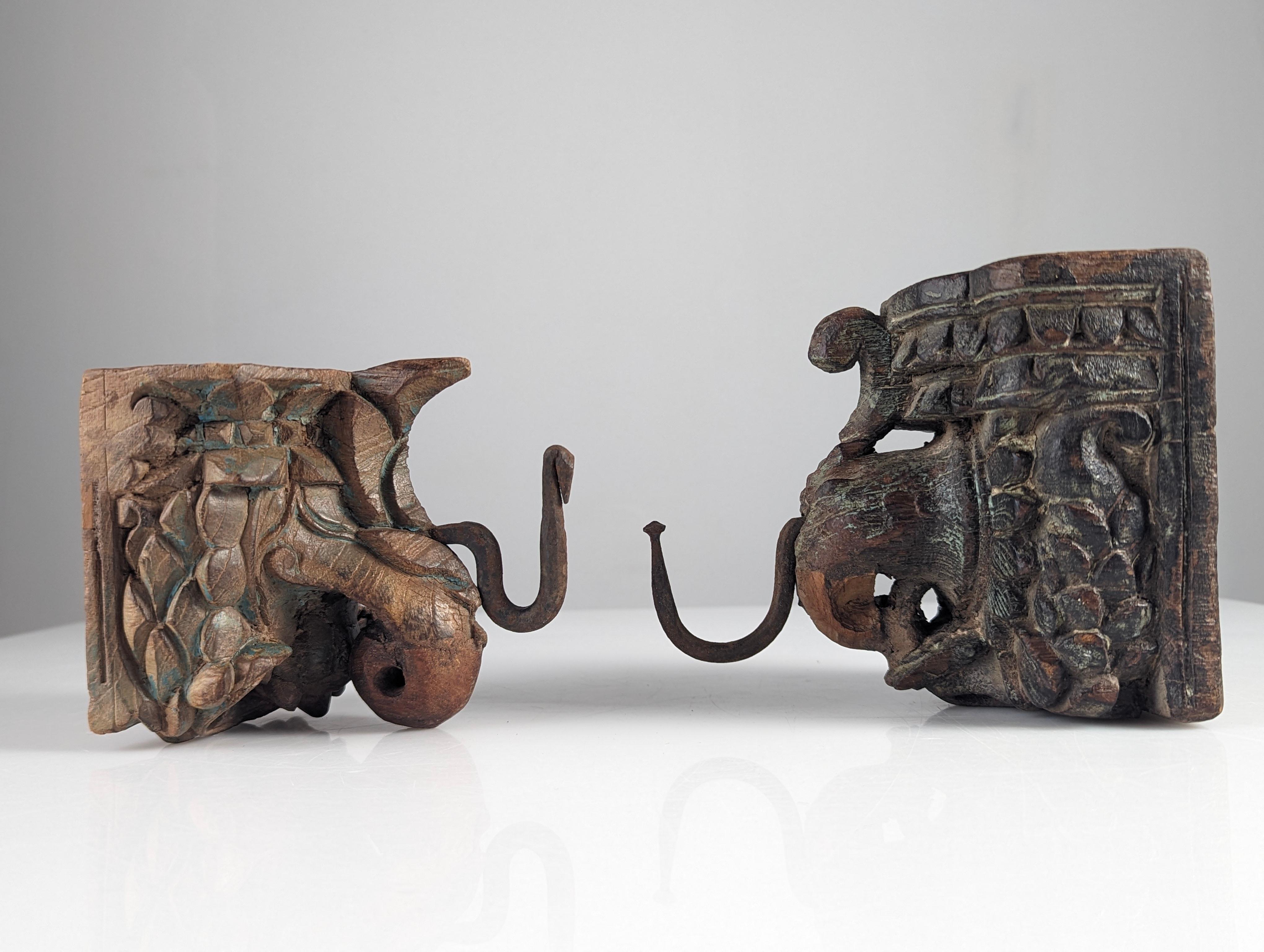 20th Century Pair of Antique Wood Carved Elephant Head Hangers, India For Sale