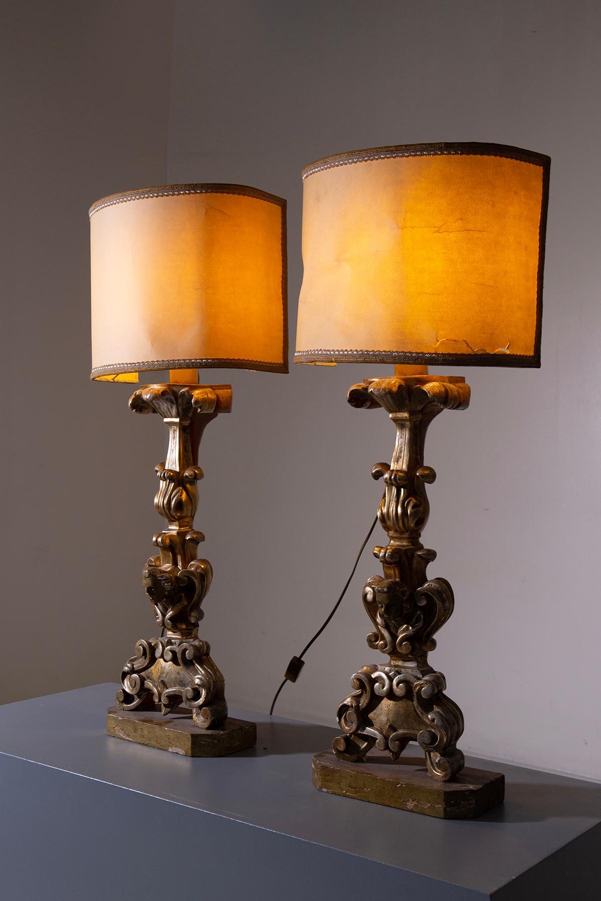 This exquisite pair of antique wooden lamps, masterfully gilded by the renowned 19th-century artisan Pietro Cipriani, embodies the quintessence of classical elegance. Crafted entirely from wood, each lamp has been meticulously carved by hand, a