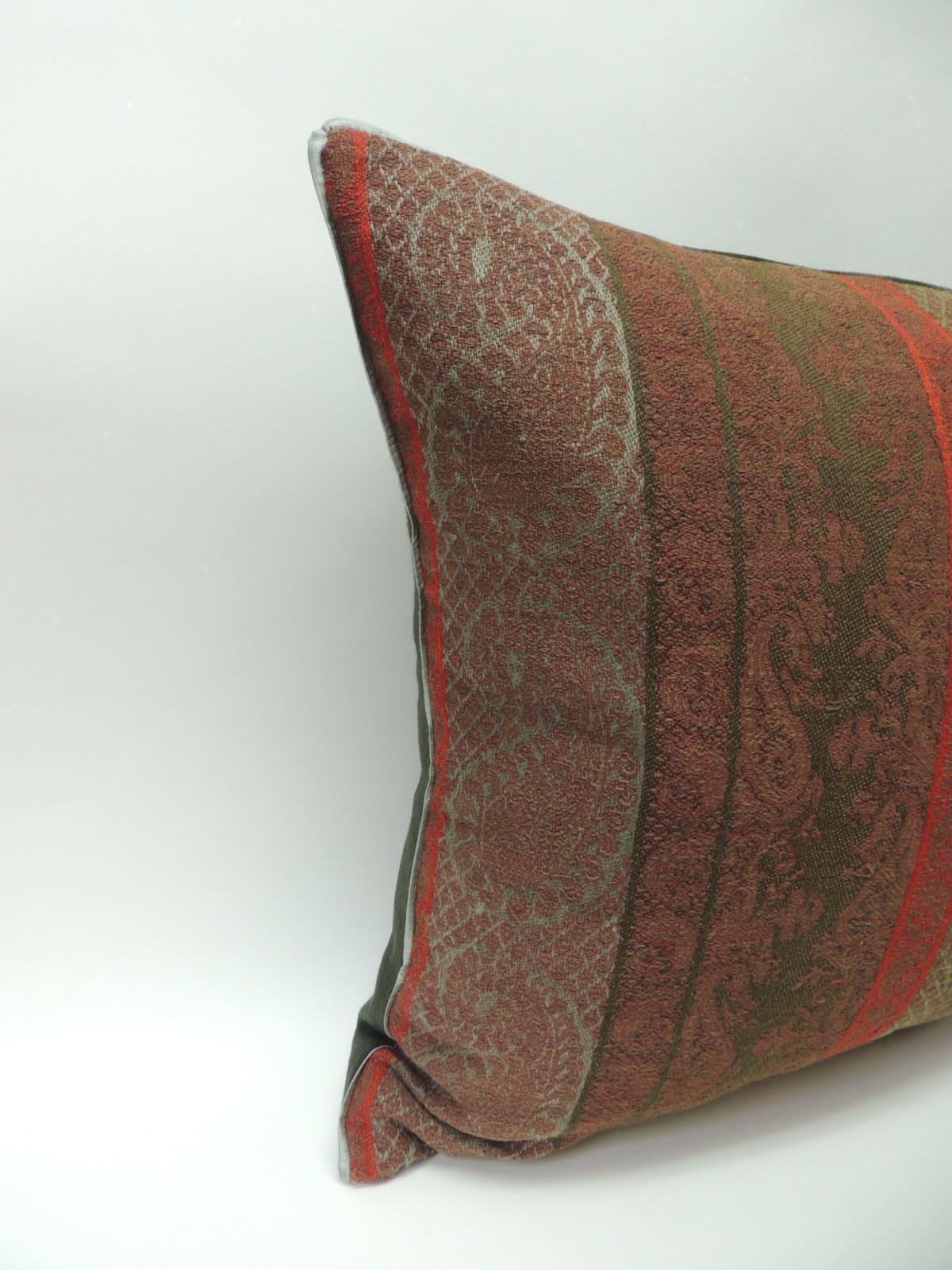 Pair of 19th century antique woven red and green Kashmir decorative pillows with green flat green silk trim and hunter green carriage cloth fabric backing.
In shades of brown, green, red and soft green. Handcrafted decorative pillow made with an