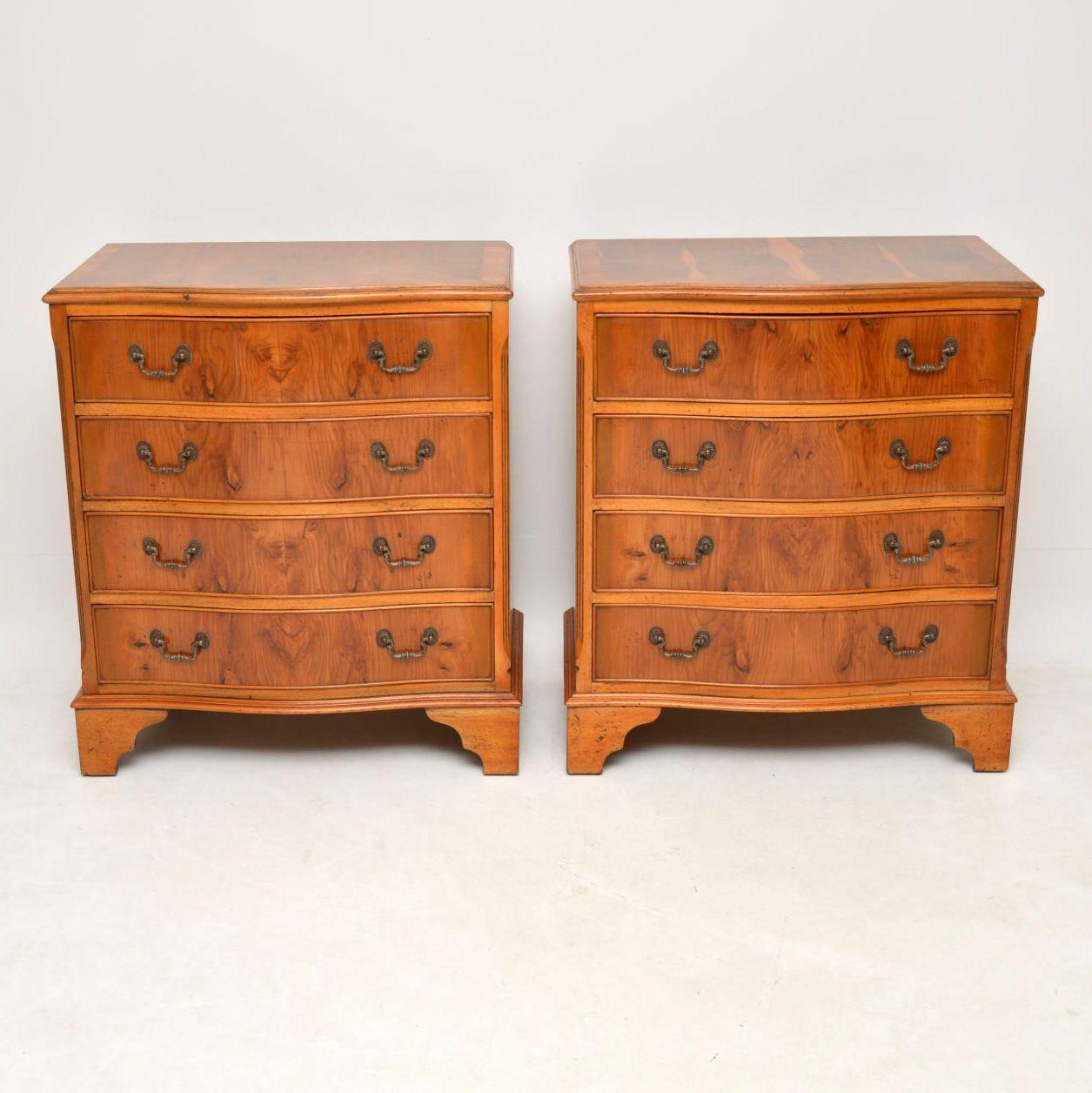 Pair of antique Georgian style serpentine fronted yew wood chests of drawers dating to around the 1950s period. They have just been French polished so are in good condition. The tops are cross banded, the drawers have original brass handles and it