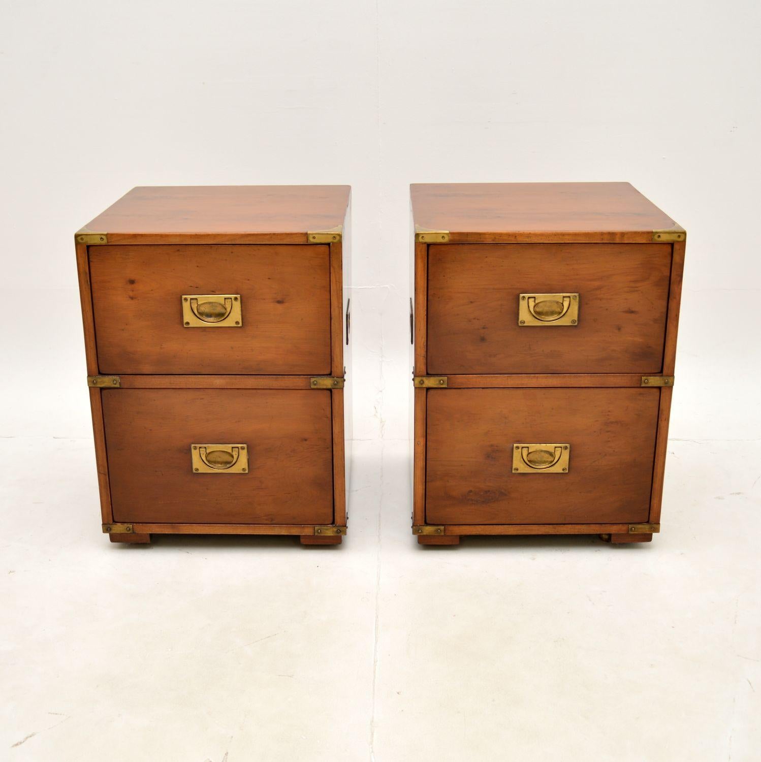 A superb pair of antique yew wood military campaign bedside chests of drawers. They were made by Kennedy furniture and were retailed in Harrods, they date from around the 1960-70’s.

They are of exceptional quality, very heavy with solid oak