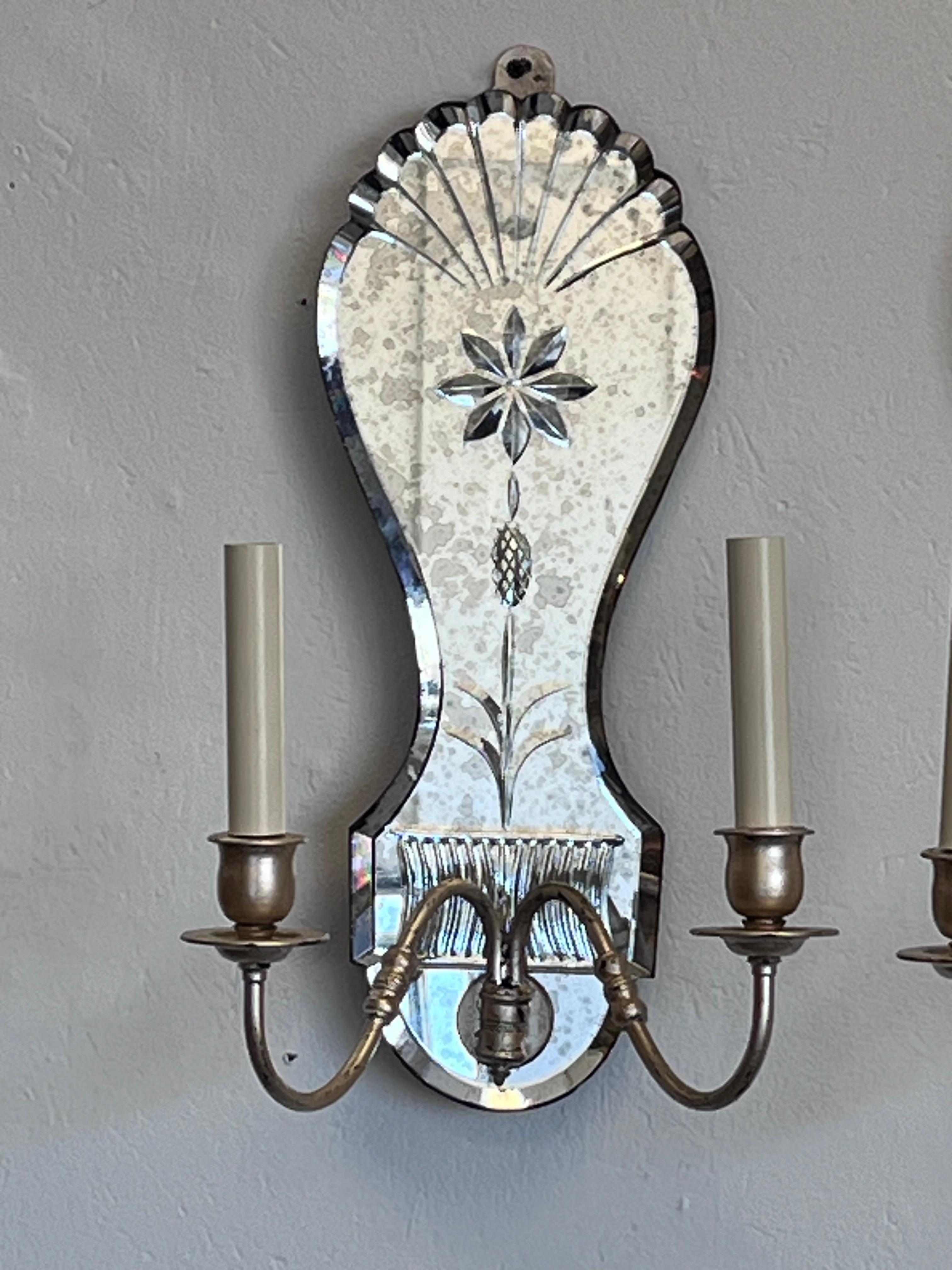 Pair of Antiqued Ornately Cut Floral Mirror Silver Gilt Double Arm Wall Sconces In Good Condition In Atlanta, GA