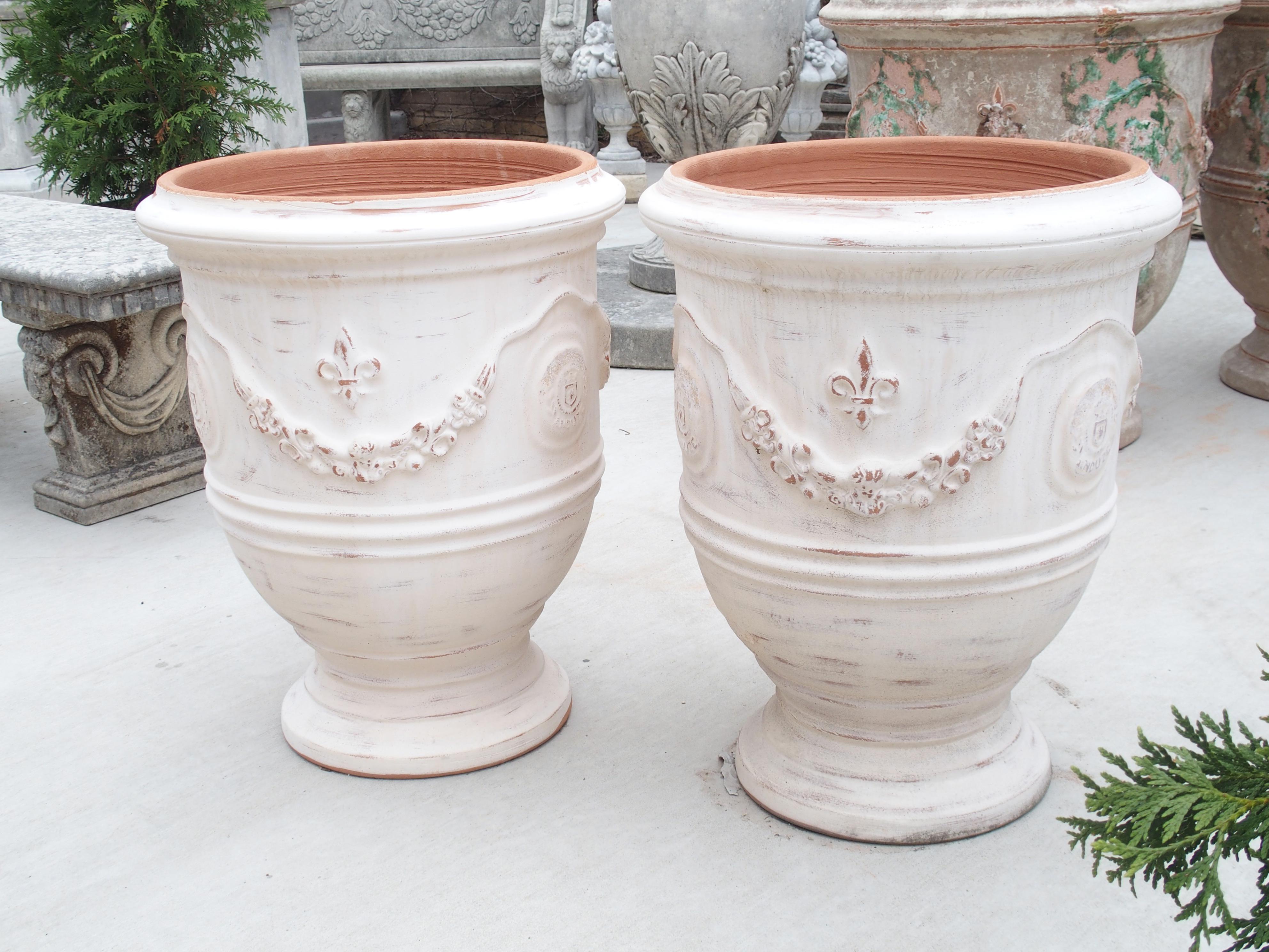 Hand-Painted Pair of Antiqued White Fleur-de-Lys Anduze Pots from France