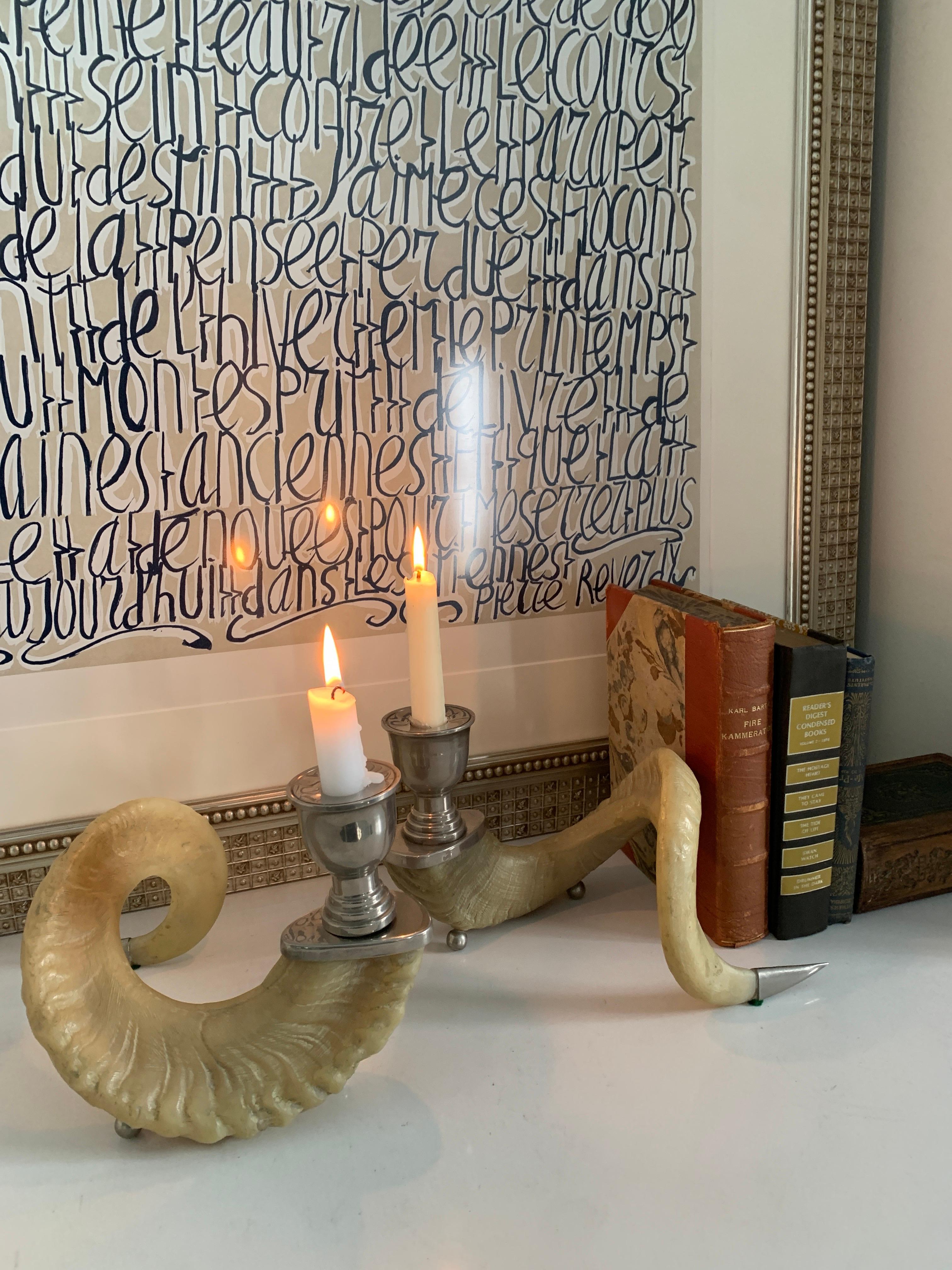 Pair of Rams Horn and silver mount candlesticks - A wonderful pair, the organic and natural aspects of the pair are a compliment to many spaces. A lovely addition to a console or dinner table.... the mounts have been polished and the horns are free