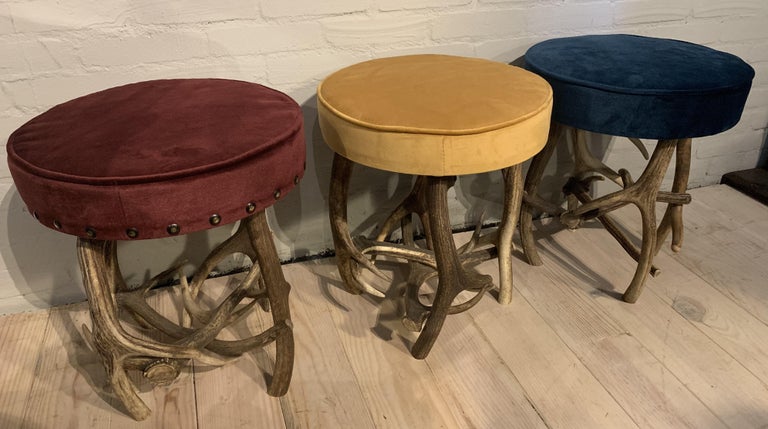 3 antler stools made of red deer antlers.
All stools are upholstered with velvet fabric to make the stools a perfect match.
