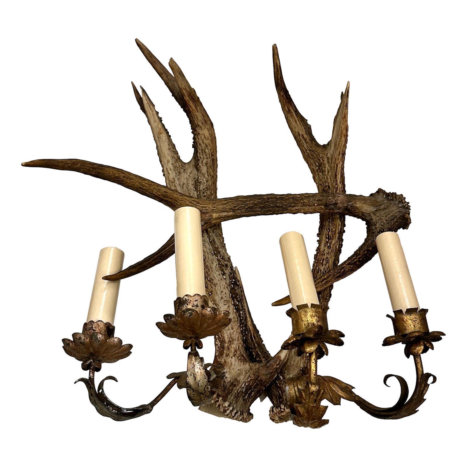 Pair of circa 1930's Northern Italian antler sconces with four gilt metal arms each.

Measurements:
Height: 18