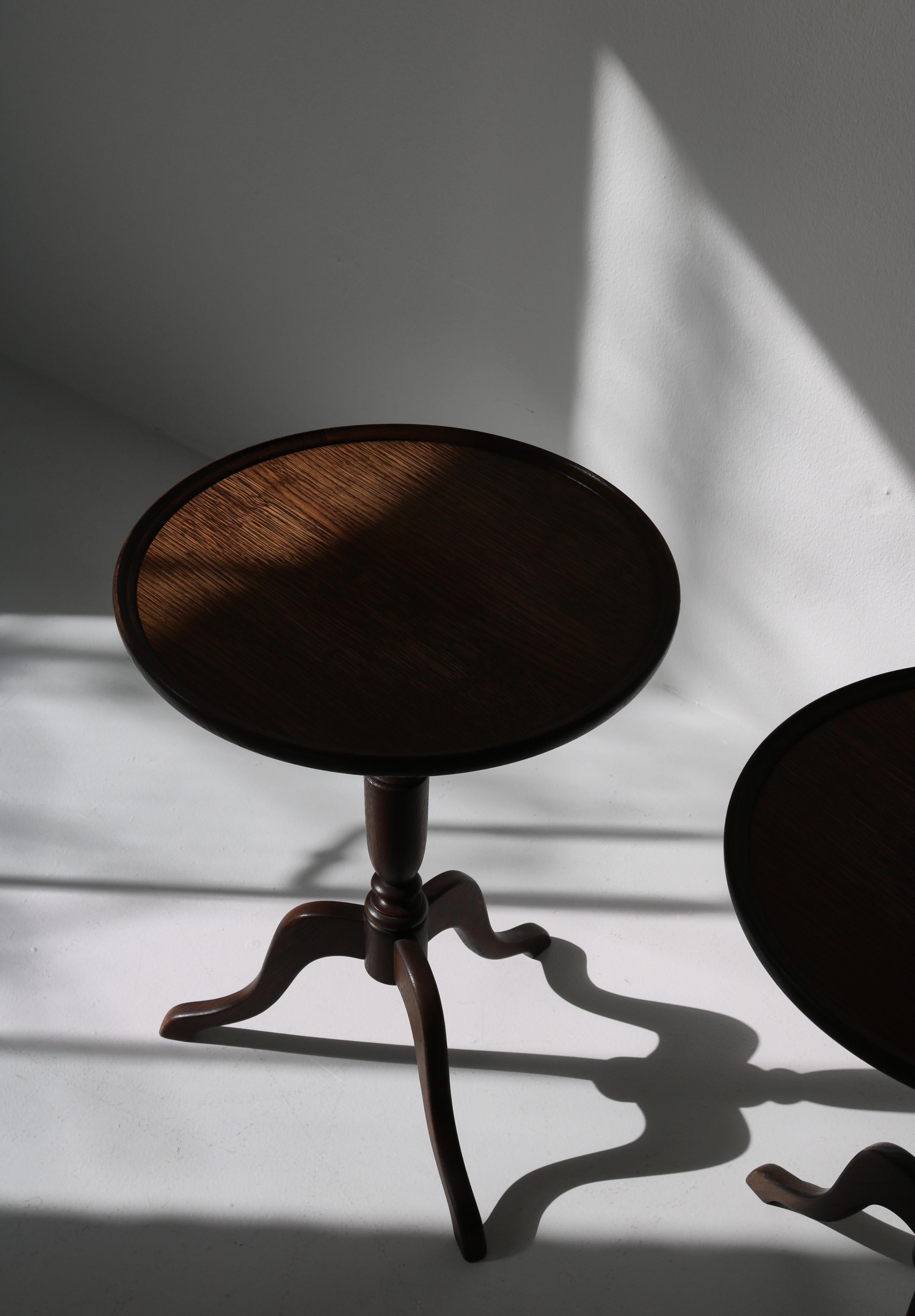 Pair of vintage side tables made at cabinetmaker Anton Kildeberg in the 1950s. The tables are made from dark stained oakwood. In the style of Fritz Henningsen. Great original condition.