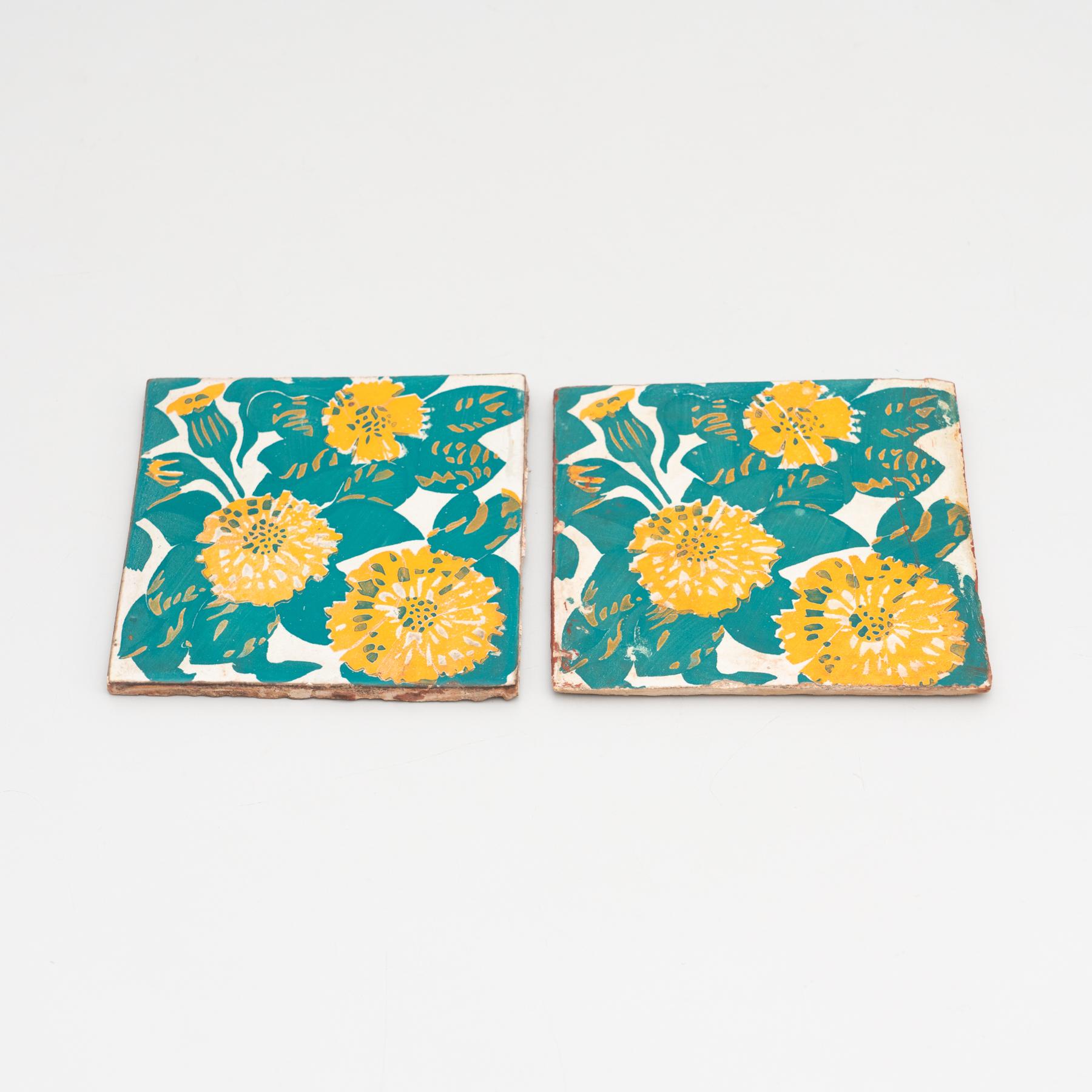 Decorative ceramic tiles by Antoni Gaudi, inspired by the marigold and dianthus motifs on the decorative ceramic tiles he designed for the facade of Casa Vicens, which constitute some of its most iconic features.

In good original condition, with