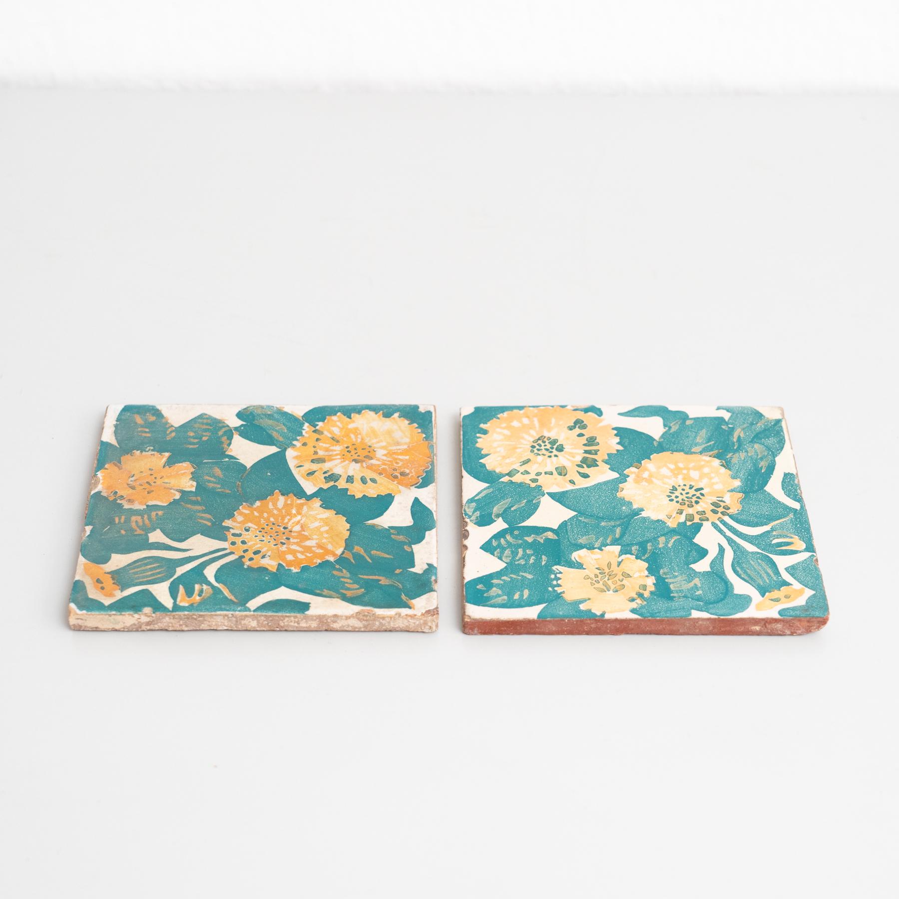 Decorative ceramic tiles by Antoni Gaudi, inspired by the marigold and dianthus motifs on the decorative ceramic tiles he designed for the facade of Casa Vicens, which constitute some of its most iconic features.

In good original condition, with