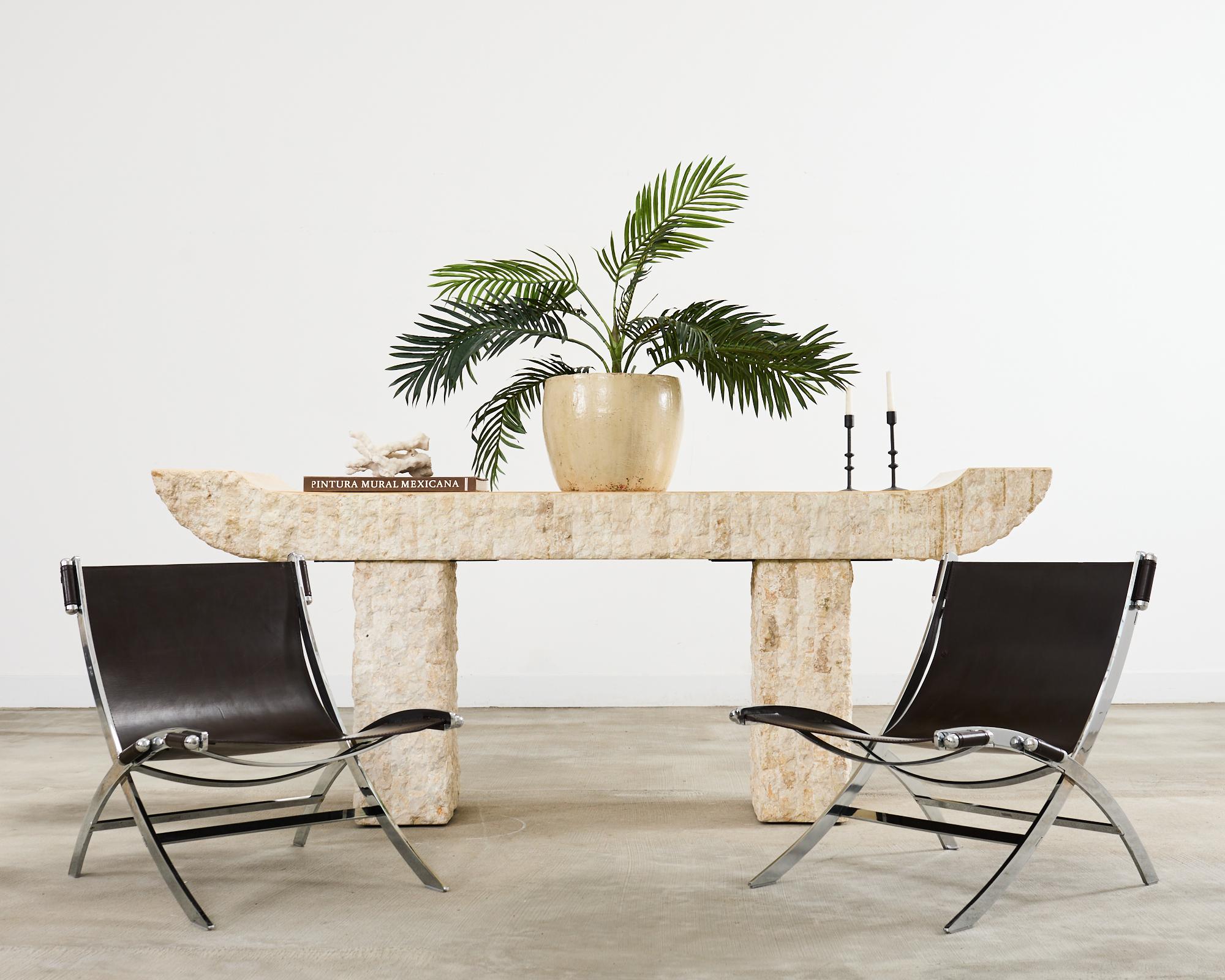 Dramatic pair of mid-century modern timeless scissor chairs designed by Antonio Citterio for Flexform. The chairs feature a chromed steel scissor frame with dark brown bonded leather slings. The thick leather was created by saddle makers and it is