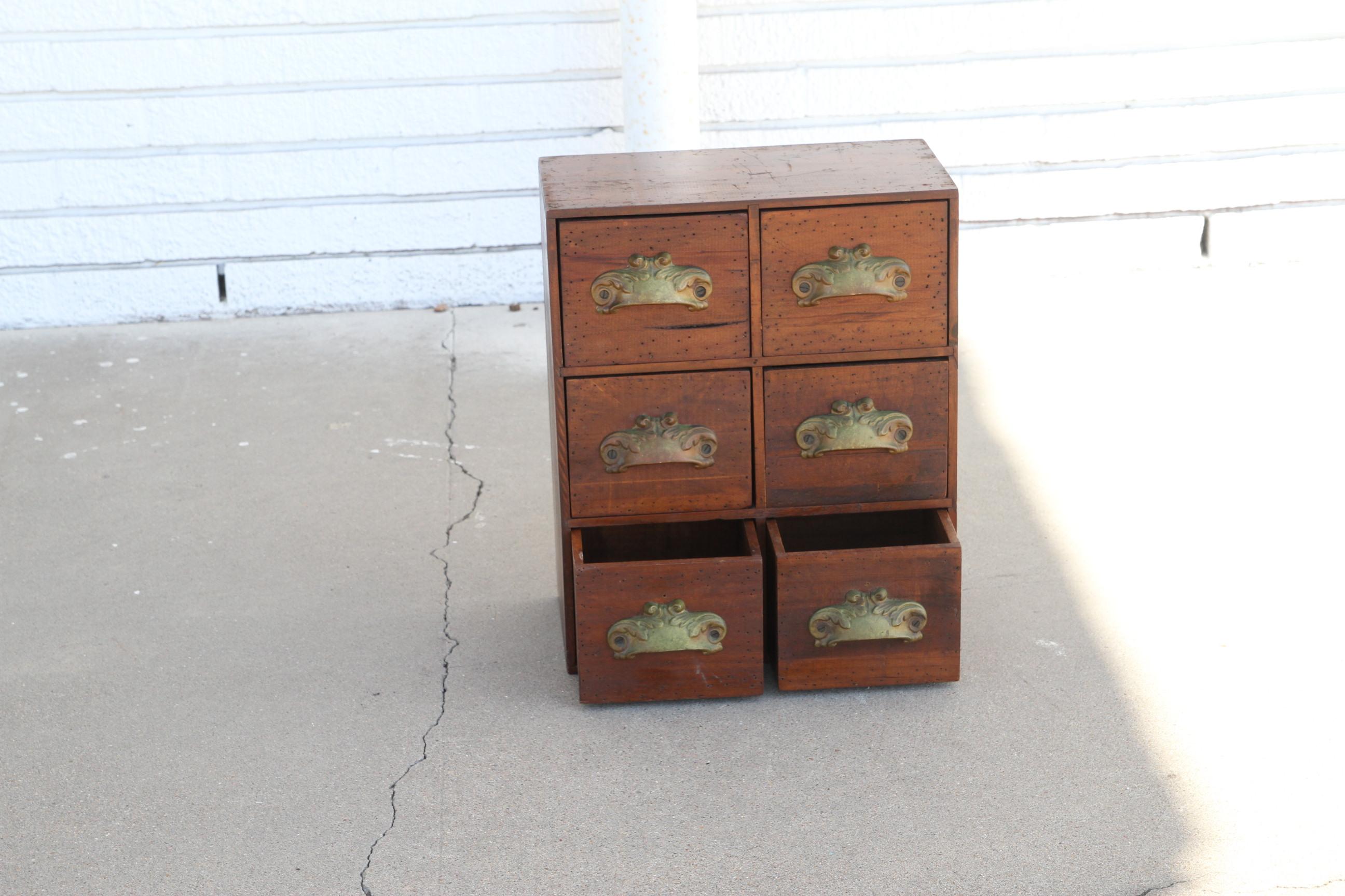 This is an antique pair of Apothecary Chest. They have Kenrick Pulls. They're nicely constructed and make for a nice conversation piece. The Kenrick Pulls date them to late the 19th century.