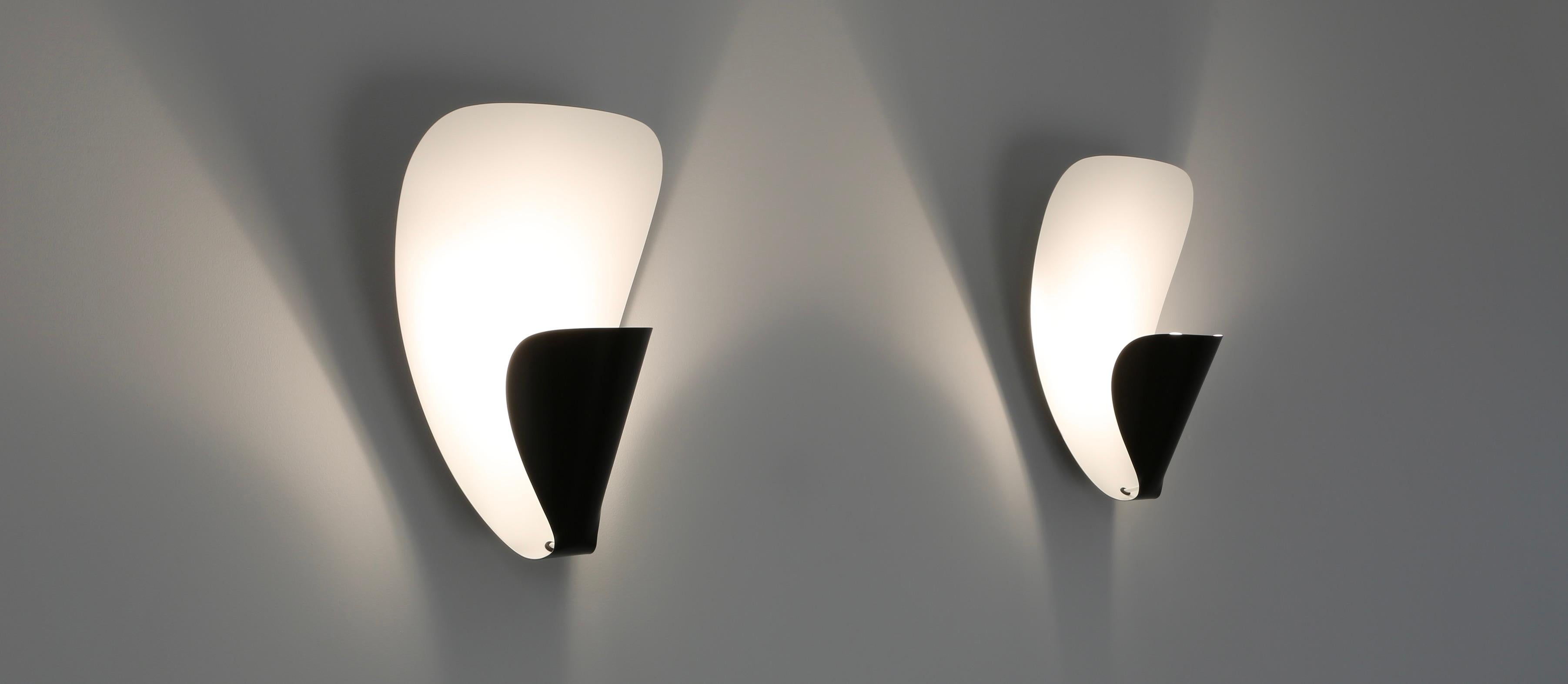 Michel Buffet a créé l'applique B206 en 1953.
 Parmi ses créations pour la maison, les luminaires se distinguent. Leurs formes géométriques abstraites ont résisté à l'épreuve du temps sans se démoder. Sculptures éteintes, elles s'illuminent par
