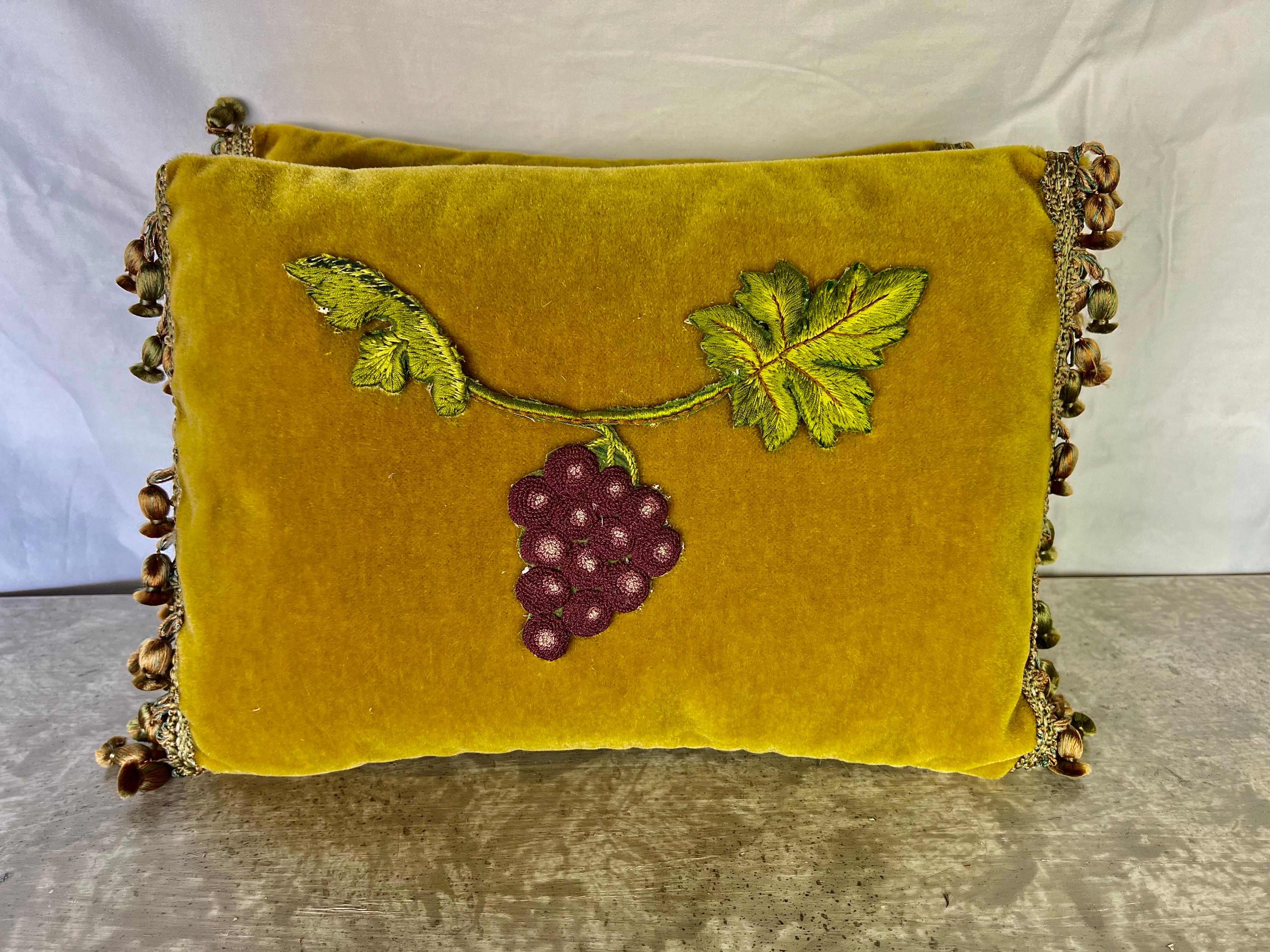 Custom pair of petite mohair pillows appliqued with a bunch of purple grapes hanging from a grape vine. Silk backs, down inserts, zipper closures.