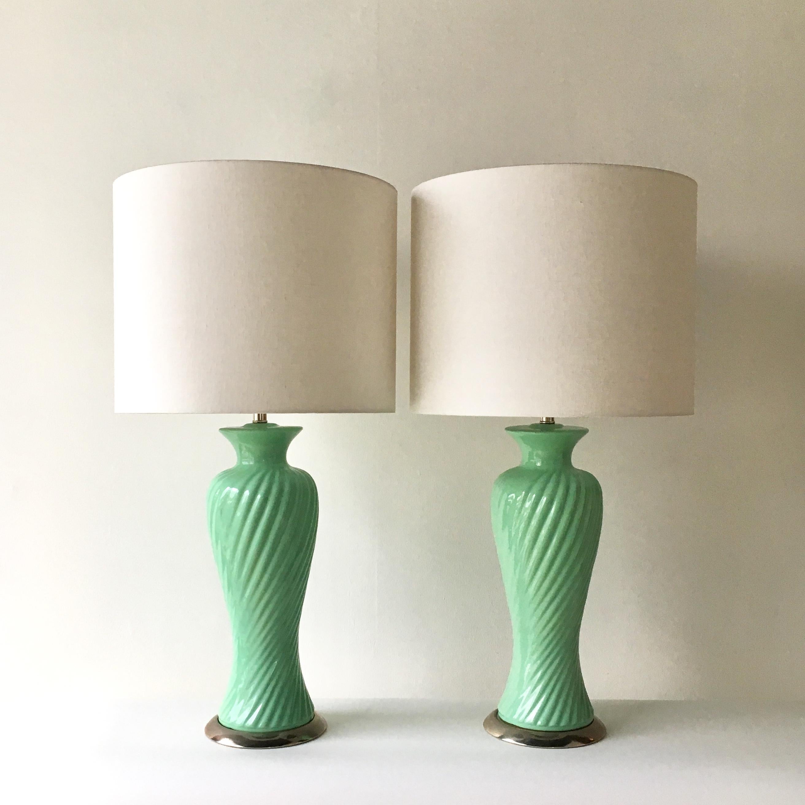A pair of aqua green ribbed glazed ceramic table lamps on nickel plated mounts 1960s
Fully refurbished and rewired by Talisman.  
Custom made lamp shades shown in photo included in price.