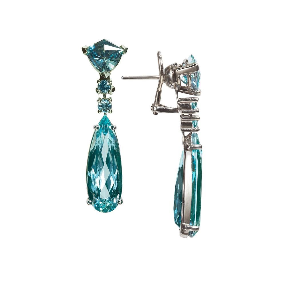 This pair of gem quality rare deep blue Aquamarine is truly a moving and sensuous experience. The gem’s most valuable color is a moderately strong, medium-dark blue to slightly greenish blue.
Featuring three different complementary Fancy shapes: