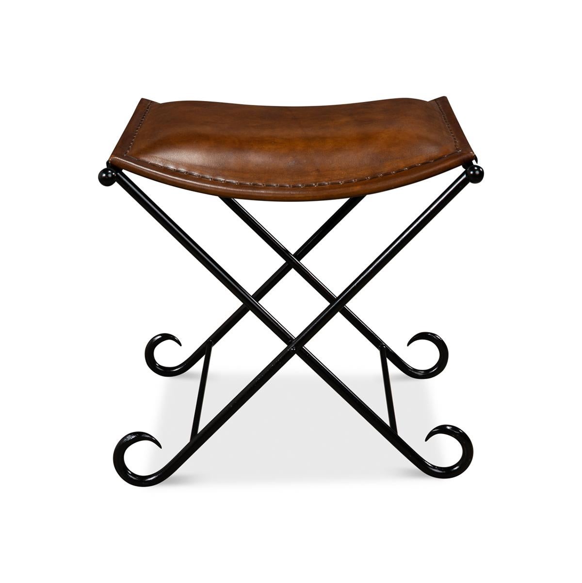 An arabesque influenced style black coated iron base and a leather slung stitched saddle seat cushion.

Dimensions: 20