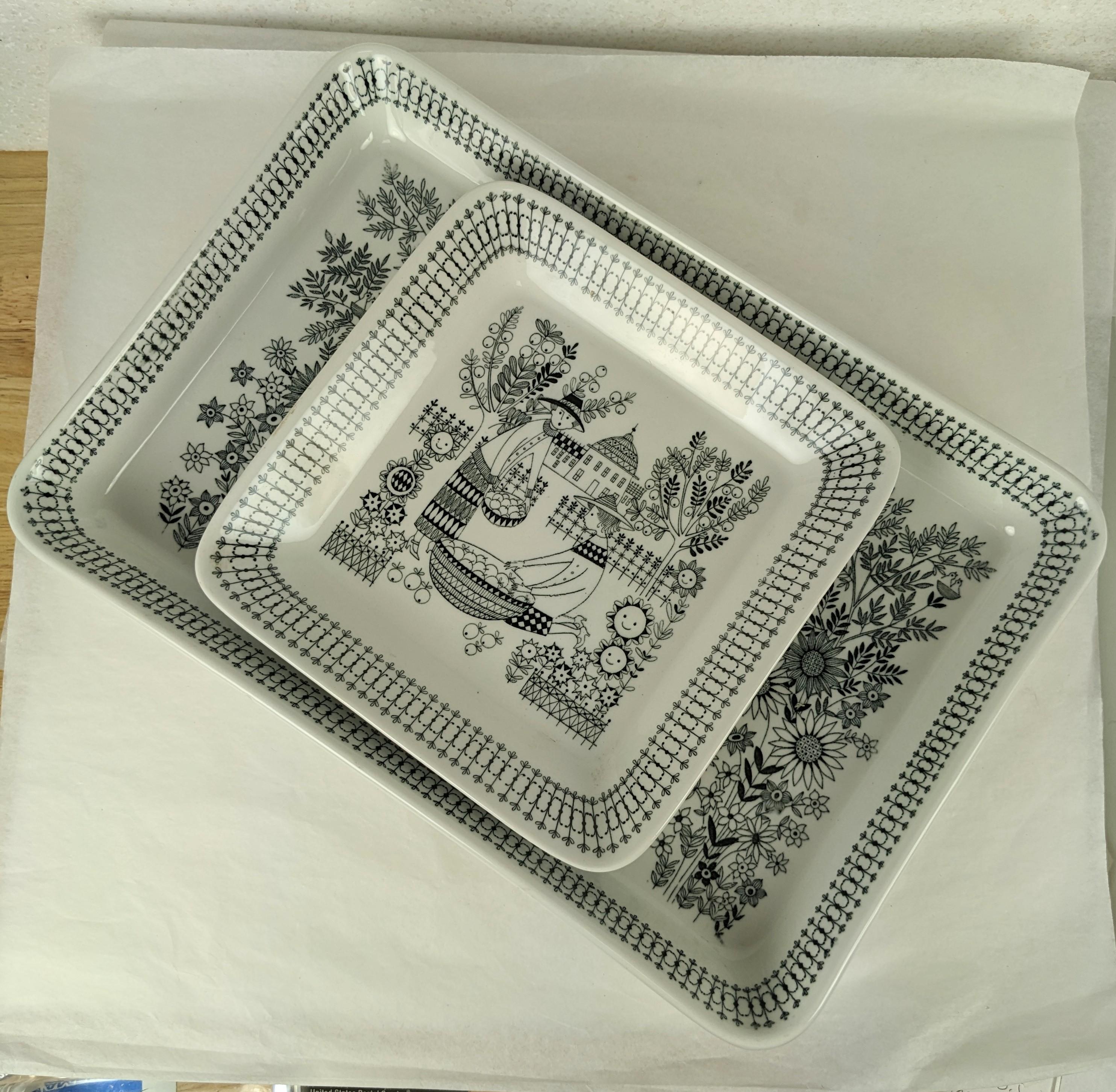 Pair of charming serving dishes by Arabia of Finland. One is a rectangular platter Emilia Pattern Tea Party, the other being Emilia, Apple Picking With Happy Flowers circa 1950's. Large 12
