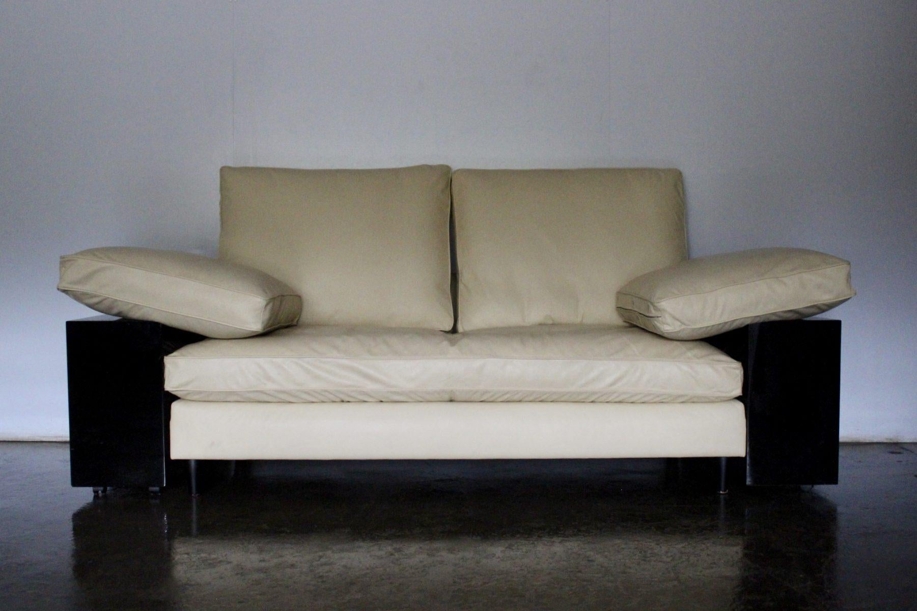 On offer on this occasion is a rare, original pair of “Eileen Gray Lota” Sofas, from the world renown furniture house of Aram, dressed in a sublime, tactile Cream Leather, and with Black Lacquered Boxes.

As you will no doubt be aware by your