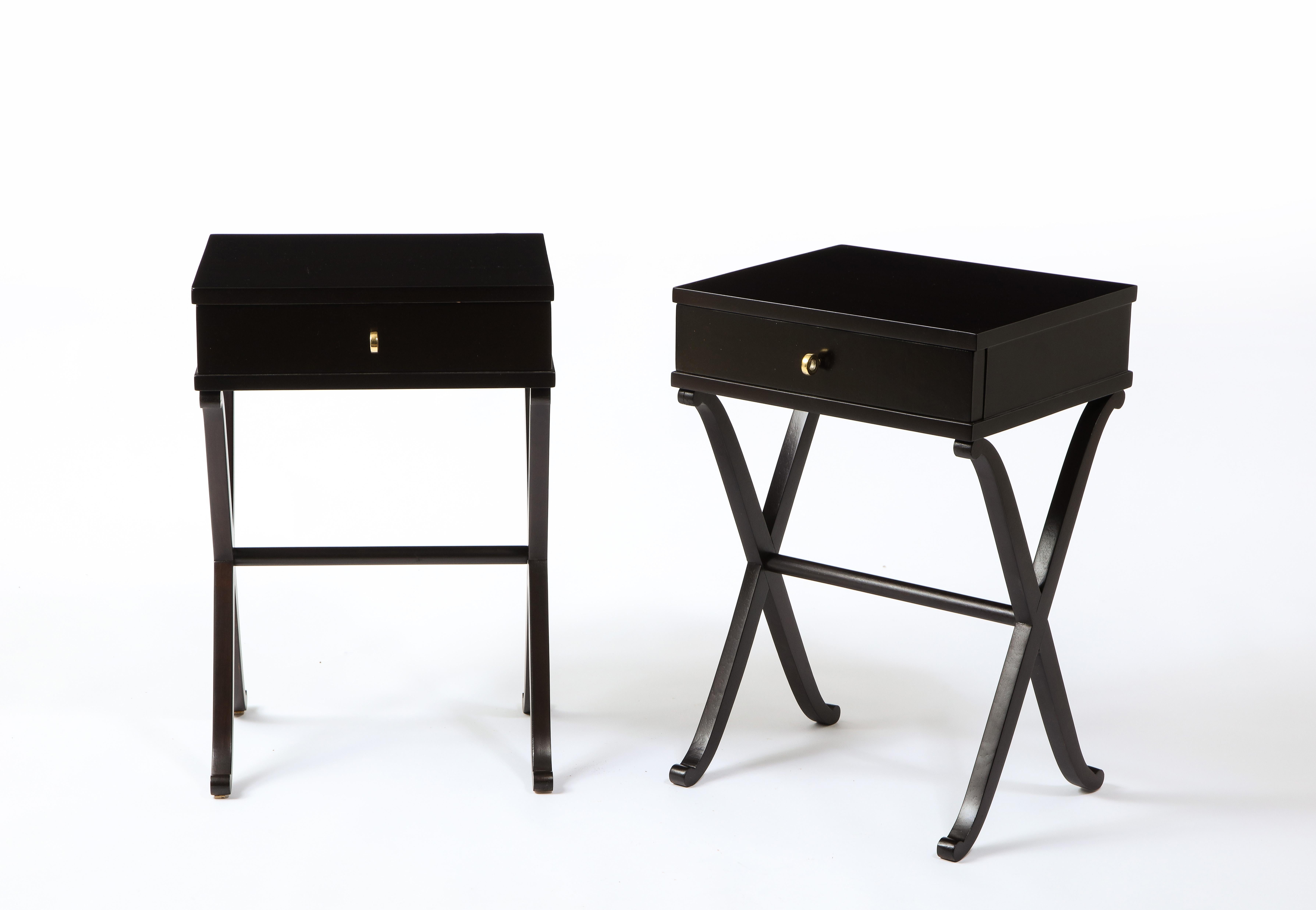 Elegant pair of end tables with x legs and one drawer. They make several nods to the work of André Arbus.