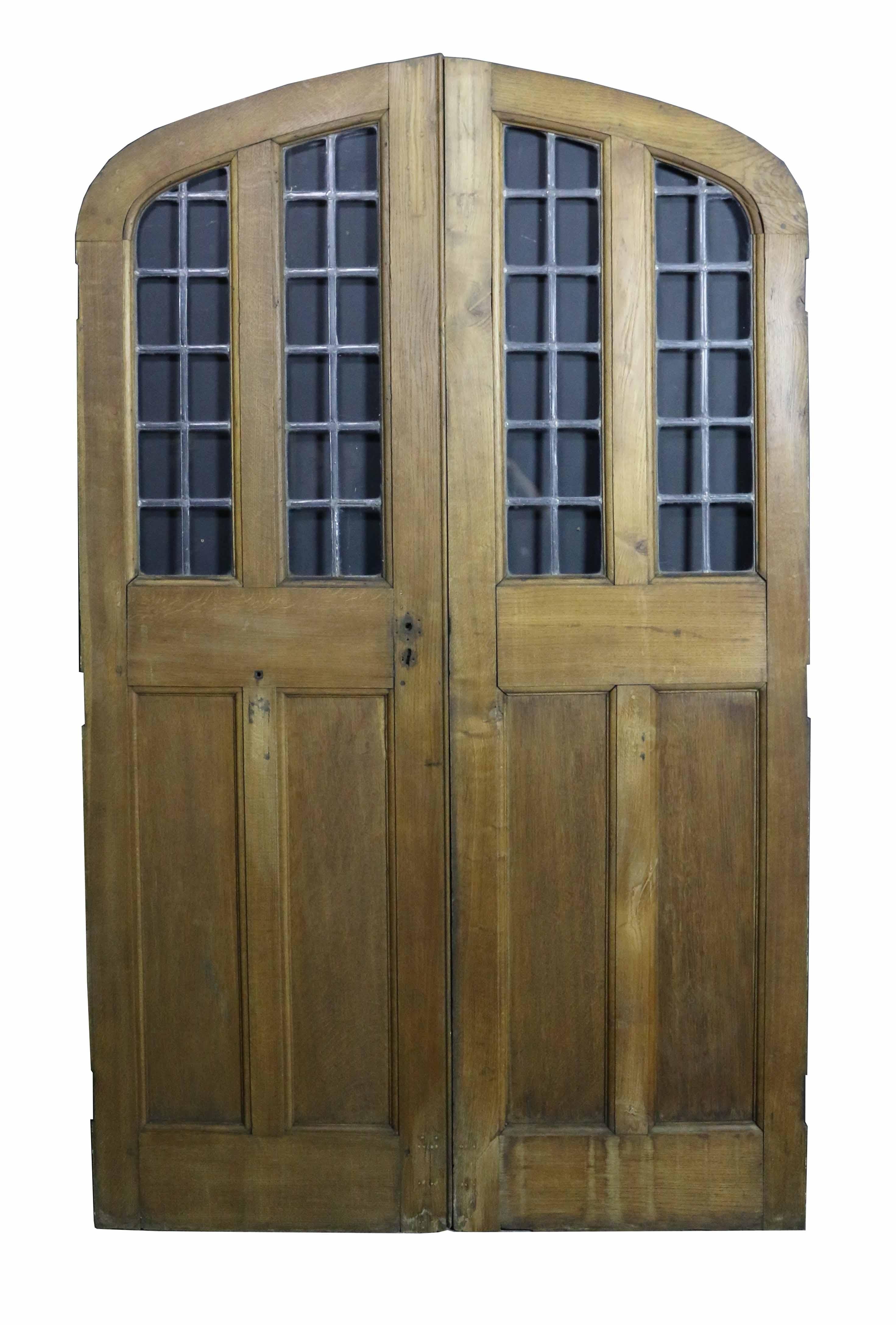 Gothic Pair of Arched Oak Double Doors with Leaded Glass Panel, circa 1900