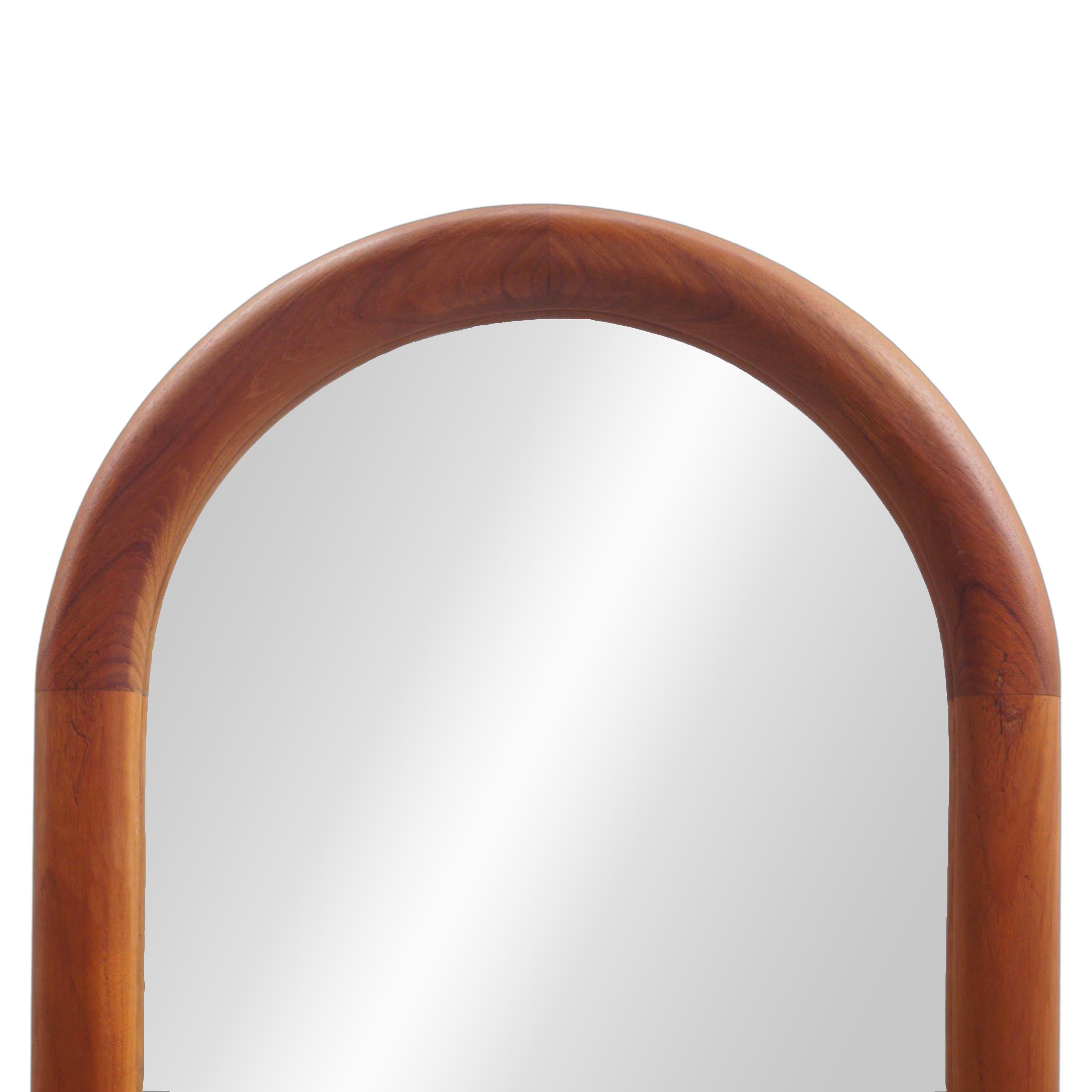 The simplicity and quality of craftmanship is the design brilliance of Mid-Century Modern style that still feels fresh and modern today. This arched mirror hits that mark with both sinuous lines and rich teakwood. It's more than just a mirror—it's a