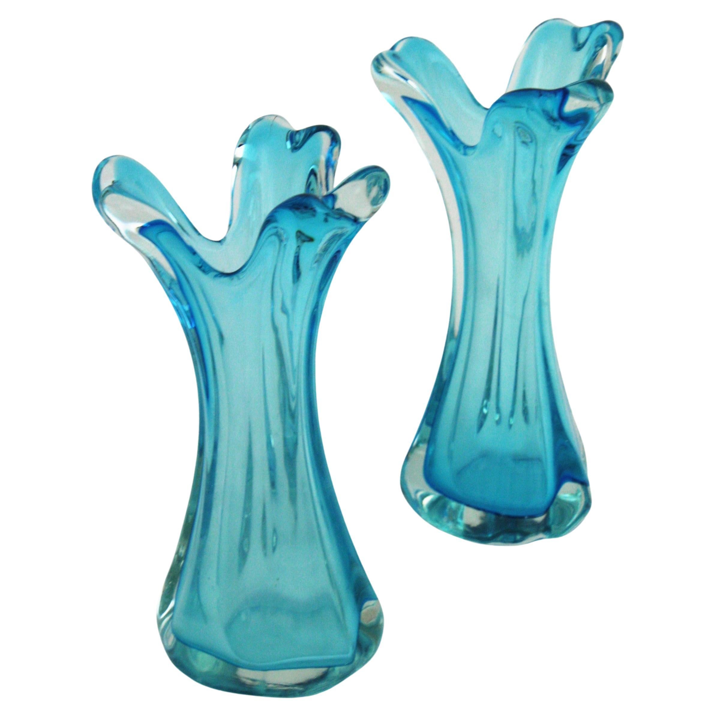Pair of Flower Vases / Decorative Vases, Murano Glass
Hand blown Murano glass Sommerso vases in a stunning shade of blue. Attributed to Archimede Seguso for Seguso Vetri d'Arte, Italy, 1950s-1960s.
Eye-catching art glass vases in clear and blue