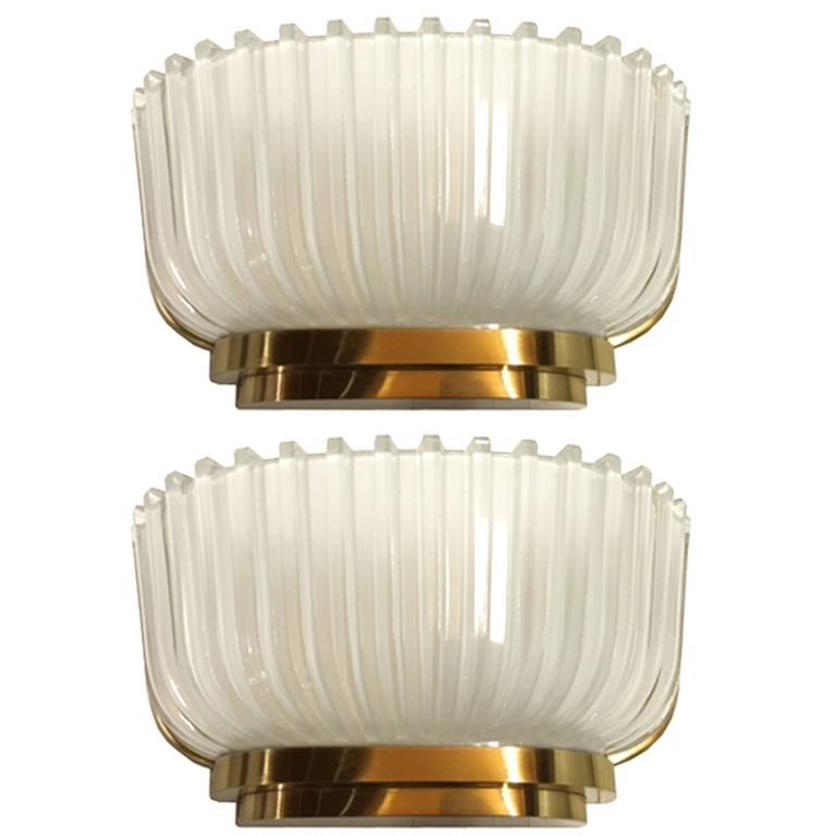 Pair of fluted glass sconces with gilt bronze frames by Archimede Seguso.

Italian, Circa 1940's