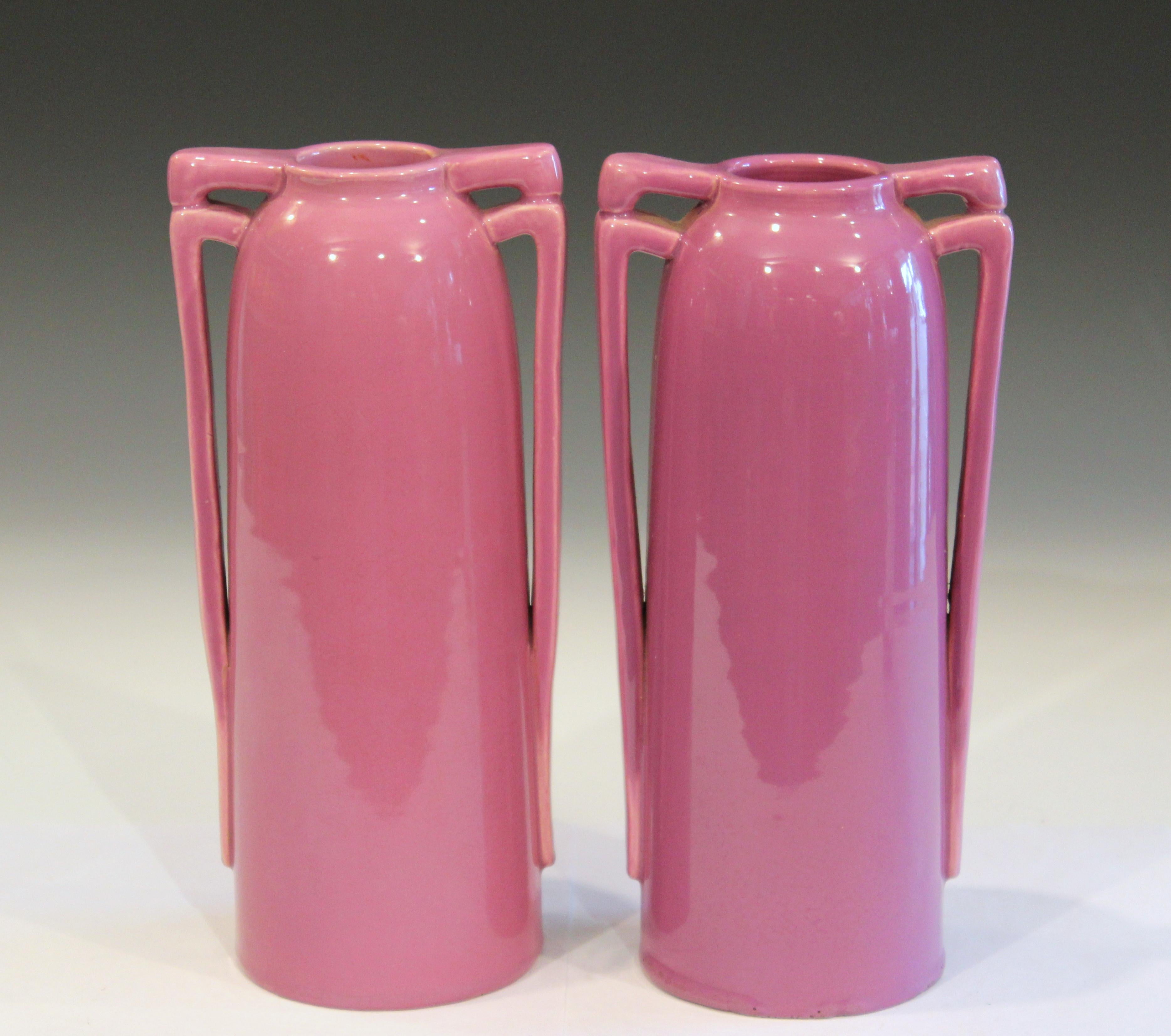 Pair of Awaji pottery vases with interesting double squared buttress handles and striking Art Deco pink glaze, circa 1930. 9 3/4