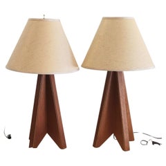 Pair of architectural origami teak tripod lamps, 1970s