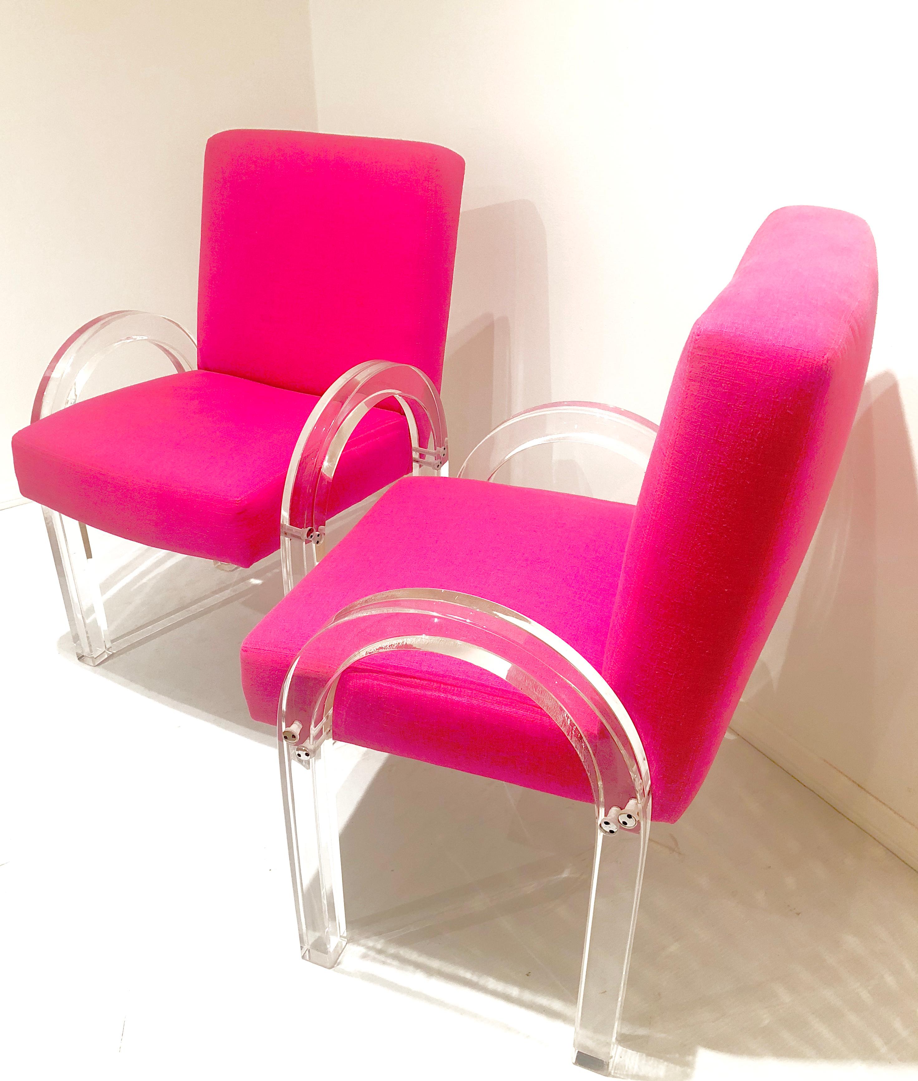 Beautiful pair of Archline Lucite armchairs. Designed by Charles Hollis Jones, circa 1980s. Freshly upholstered in a bright Mexican fuscia linen material. The arms have been polished and they have new foam. These pair of chairs are chic and elegant.