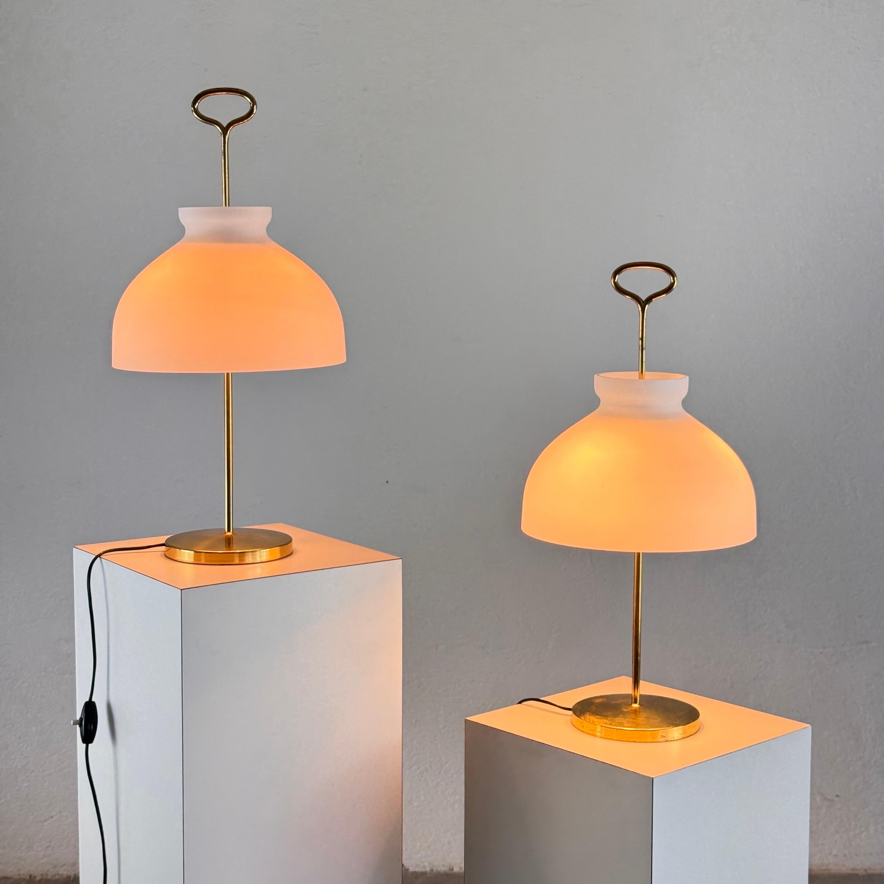 A rare, original and refined pair of Arenzano table lamps designed by Ignazio Gardella for Azucena in 1956, and produced circa 1965. Named after the Ligurian town where Gardella completed several architectural works, the Arenzano is a discreetly