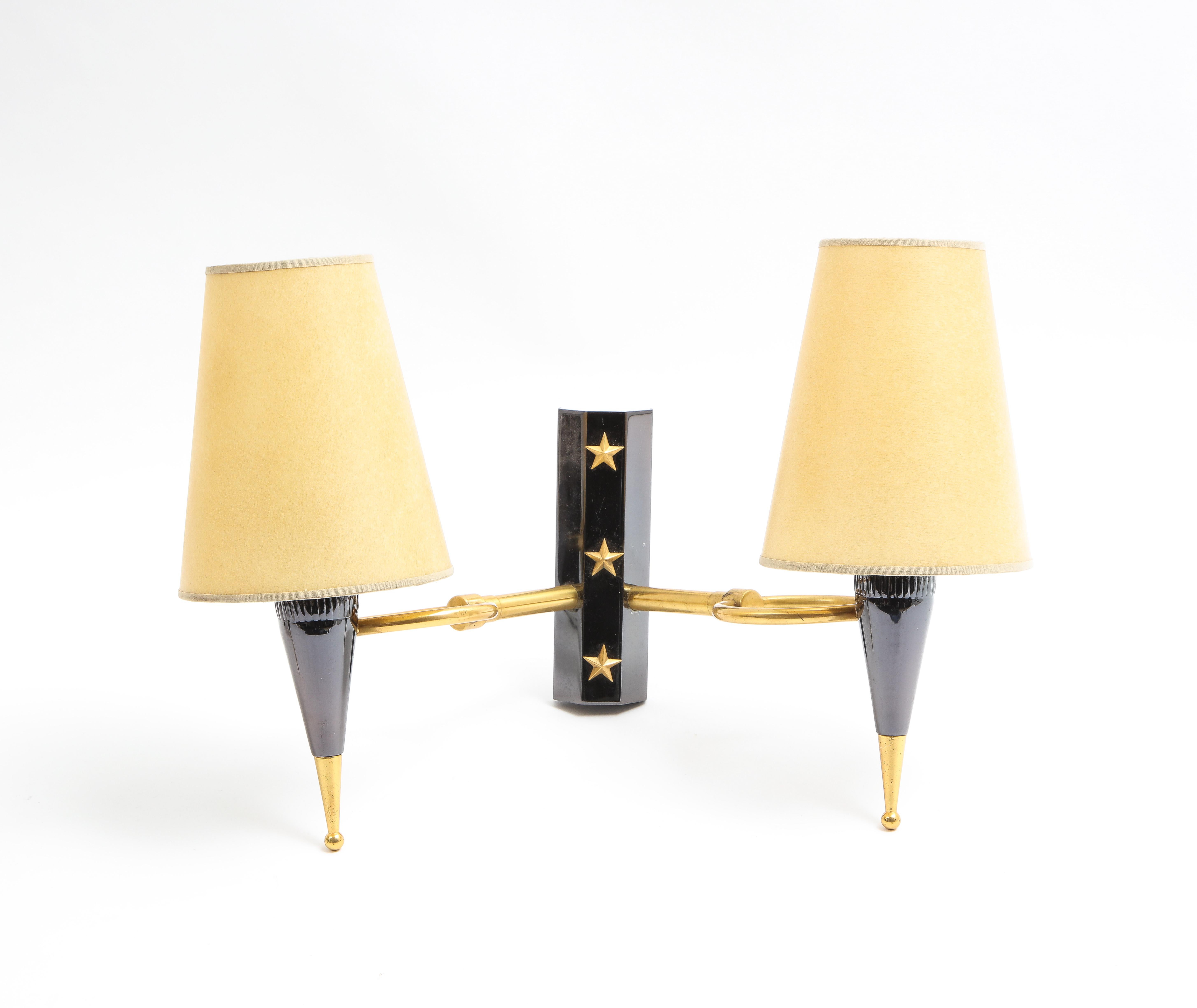 Pair of 2 lights sconces in gunmetal and brass, the light sockets are held in place by brass rings. 
Rewired.