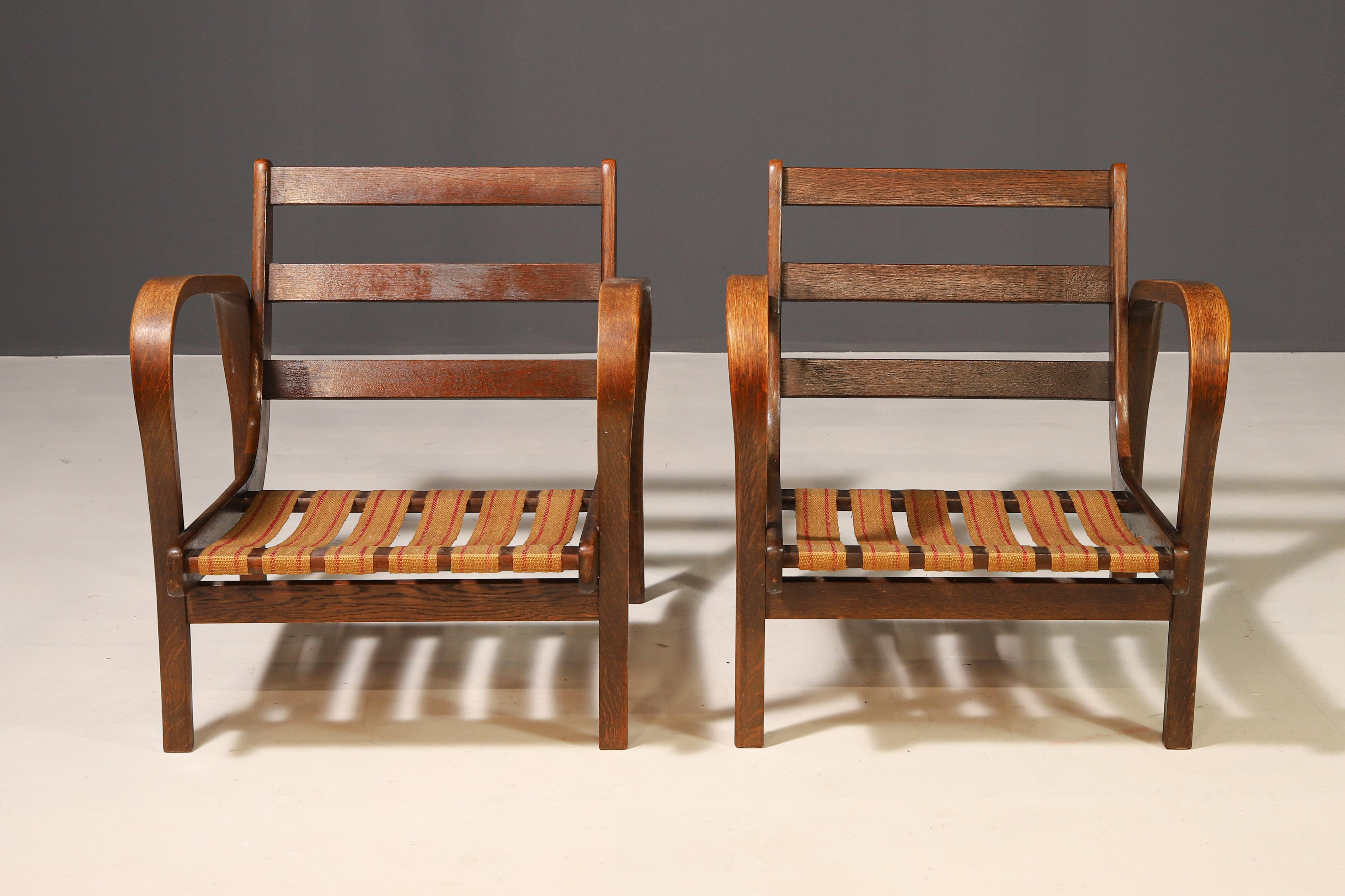 This elegant pair of armchairs was designed by renowned Czech designers Karel Kozelka and Antonín Kropáček, who significantly influenced modernist furniture of the 1940s. Created for Interier Praha, these chairs feature simple yet refined lines that