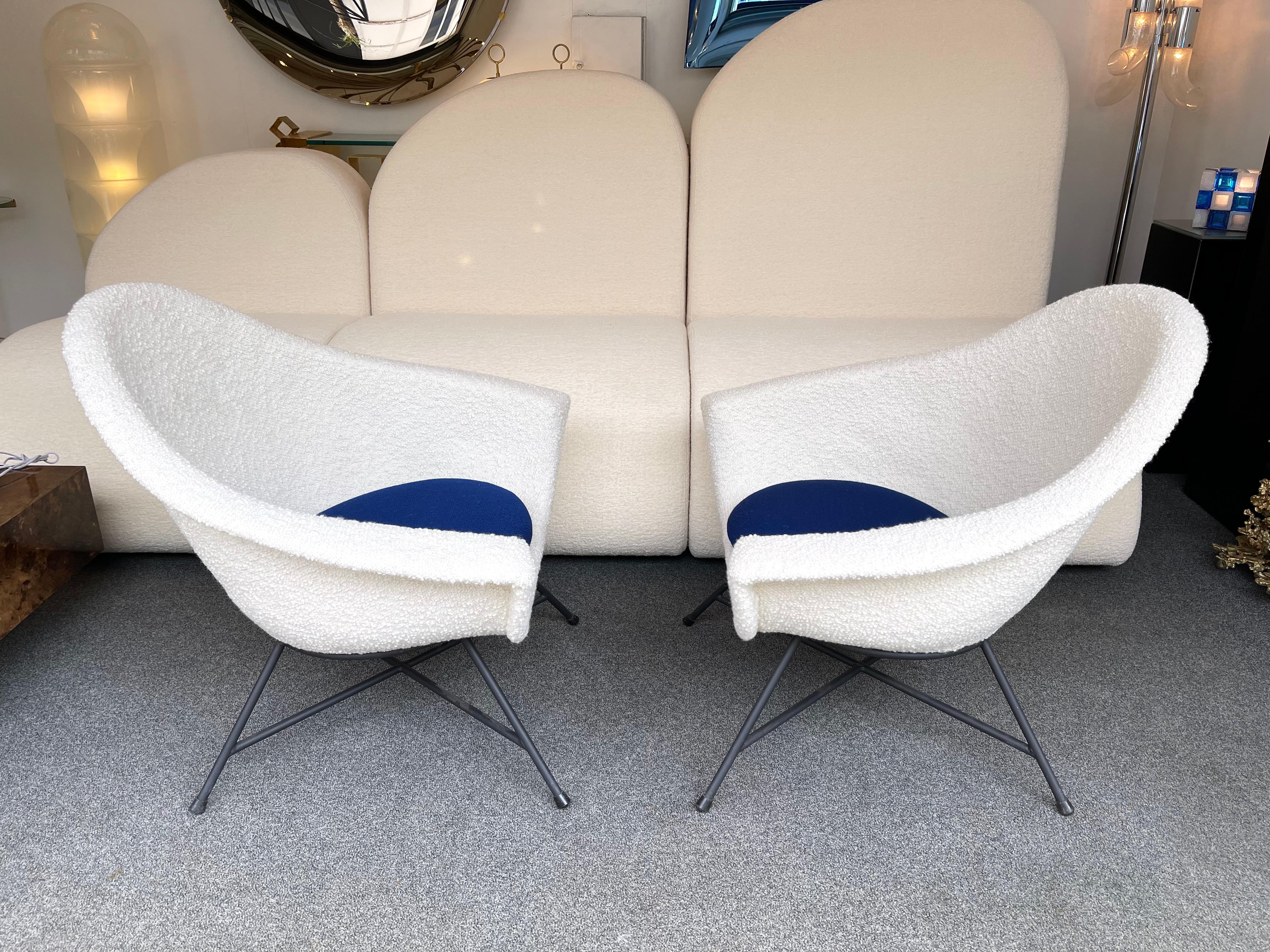Pair of armchairs model 58, first edition with fiberglass shell and black lacquered metal feet by Genevieve Dangles and Christian Defrance for the editor Burov. New upholstery in bouclé fabric. Famous design like Charles Ramos, Claude Delor, Pierre