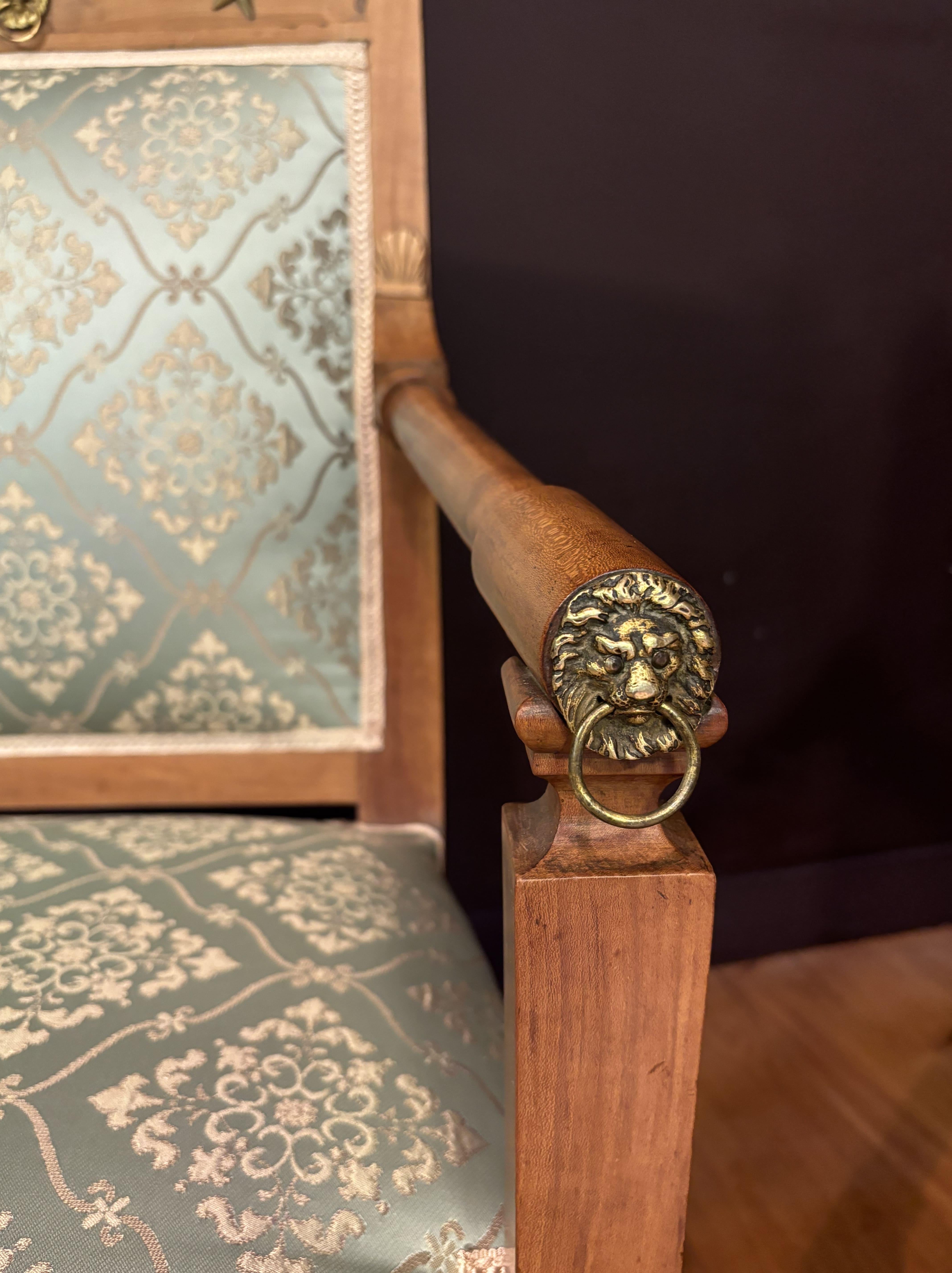 19th century Pair Of French Armchairs And Curule Stool, Restoration Period 
Exquisite Restoration era set: pair of cherry wood armchairs and curule stool. 
Discover history and elegance with this refined set, featuring a pair of beautiful crafted
