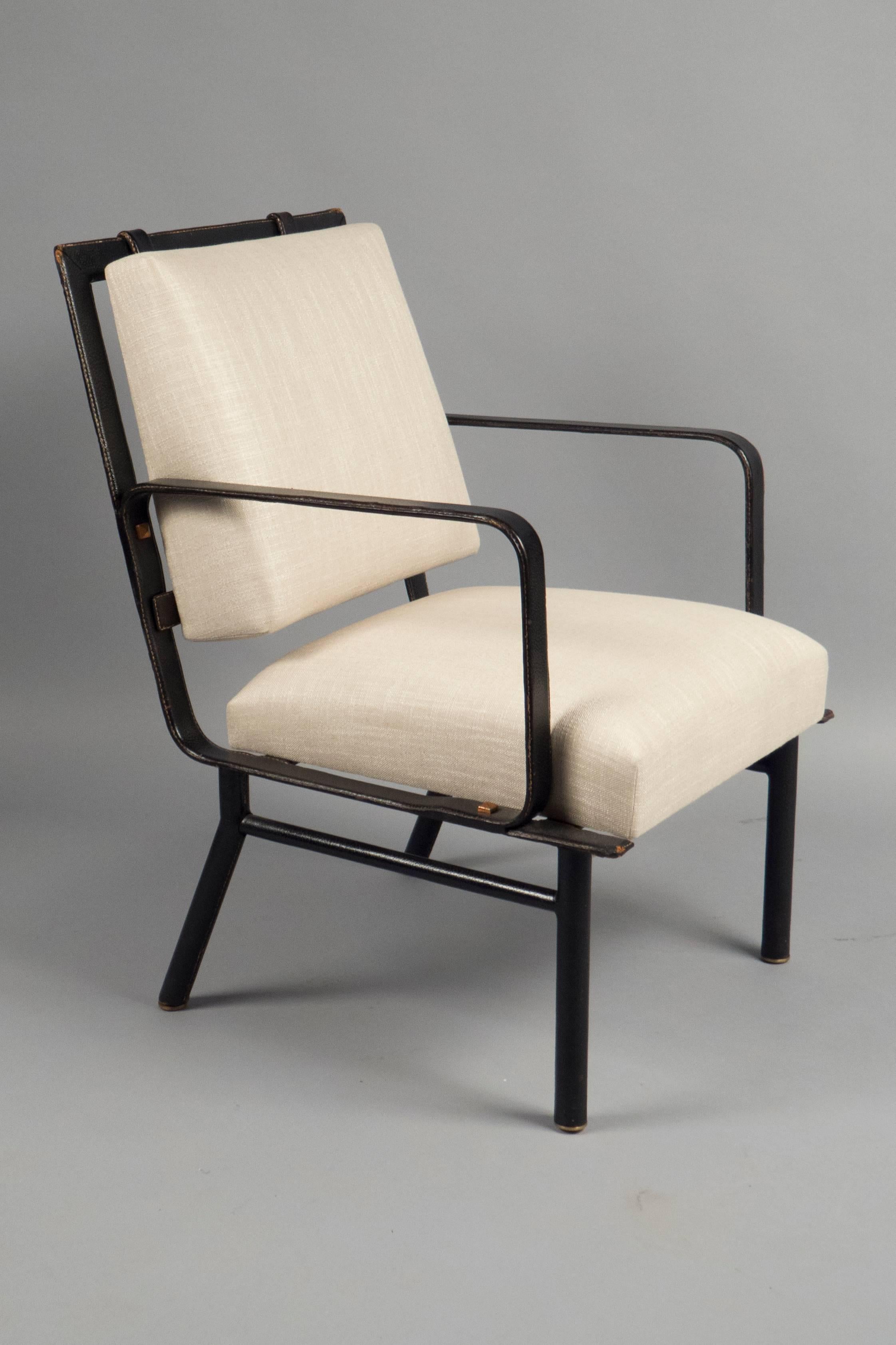 Tubular steel frames sleeved in saddle stitched black leather throughout, the seats and backs are newly upholstered.

Measures: Height 36”, width 23”, depth 25 1/2”.
Seat height 18”.